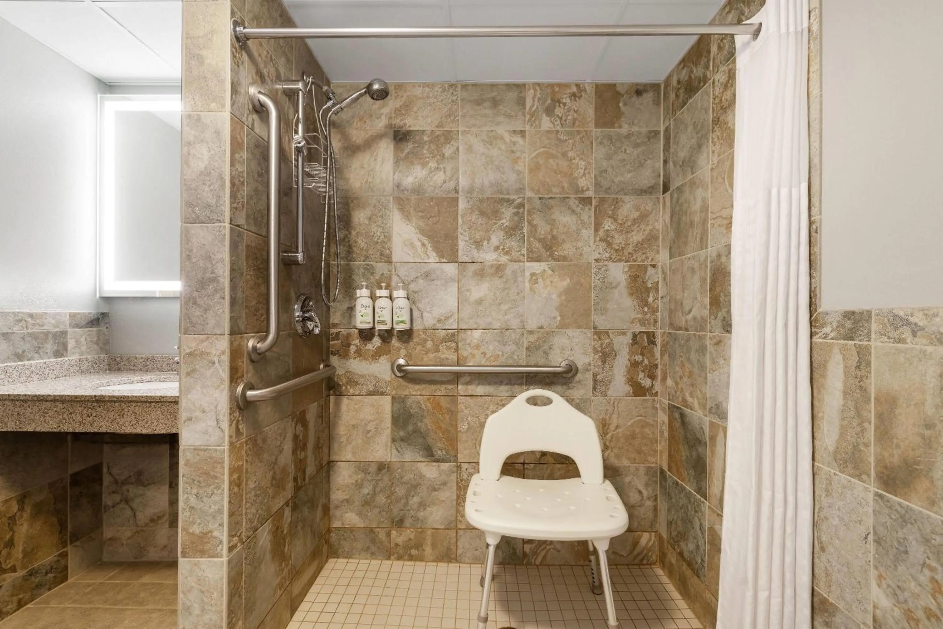 Shower in AmericInn by Wyndham Chamberlain Conference Center