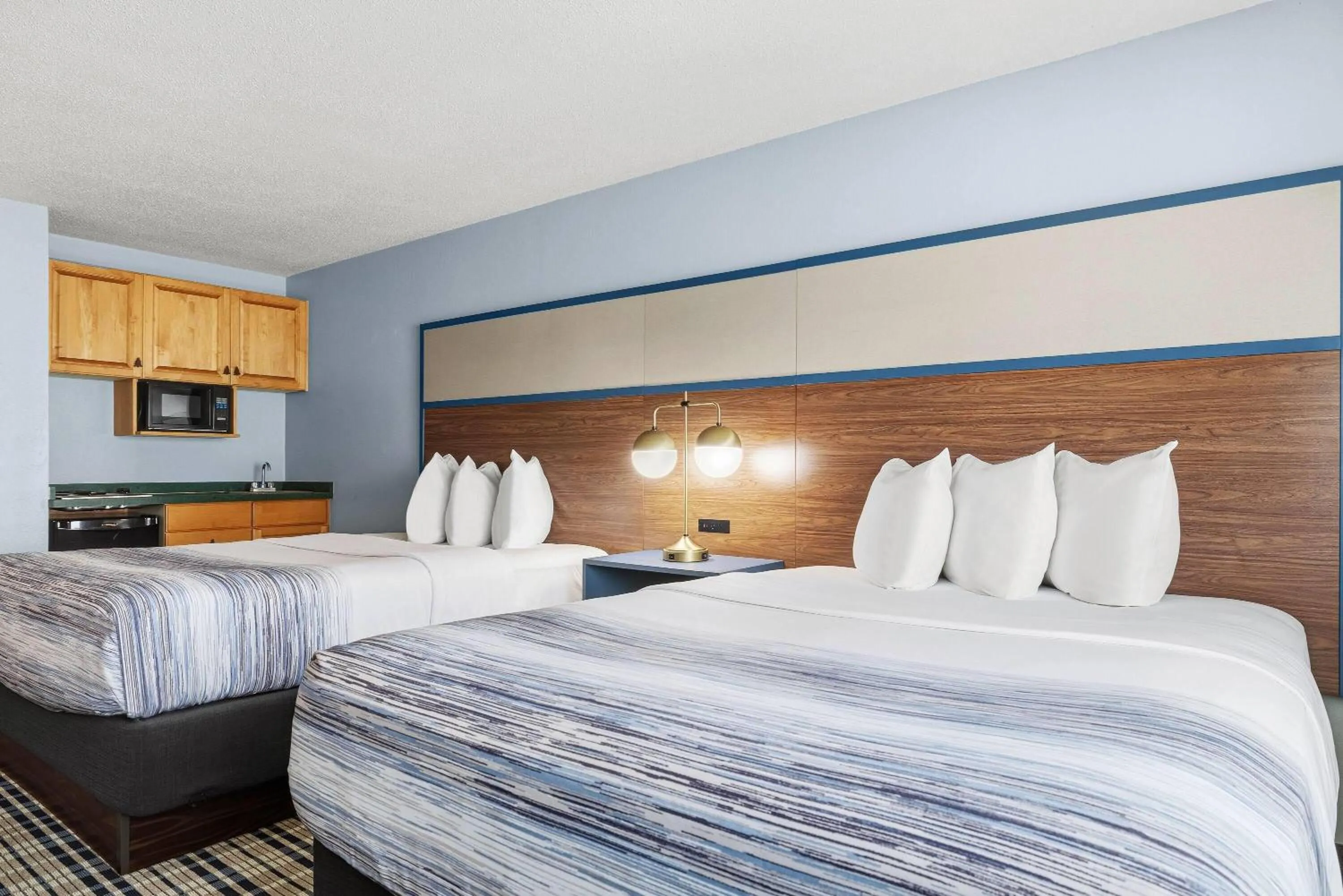 Bed in AmericInn by Wyndham Chamberlain Conference Center