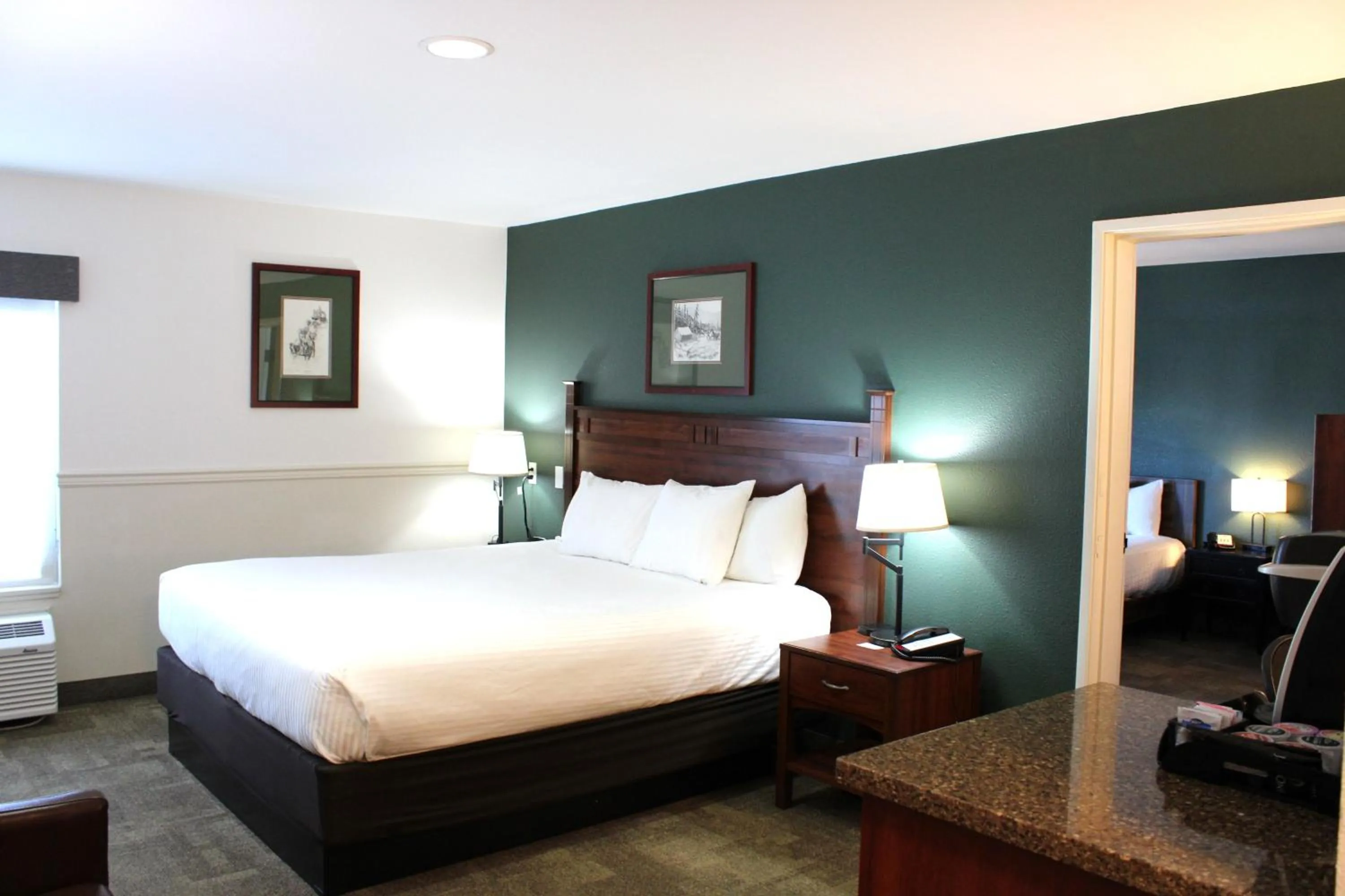 Bedroom, Bed in Boothill Inn and Suites