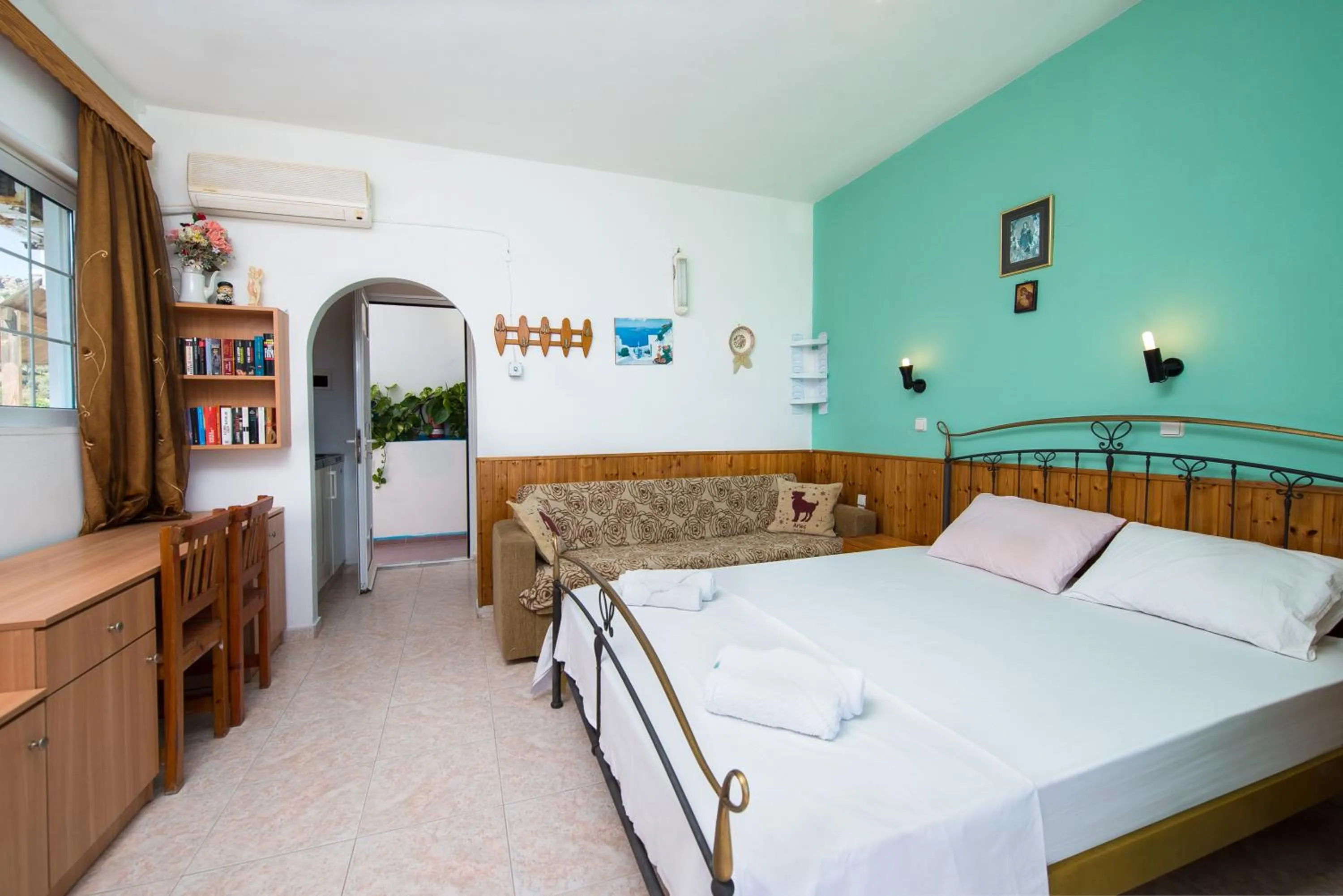 Bed in Poseidon Apartment