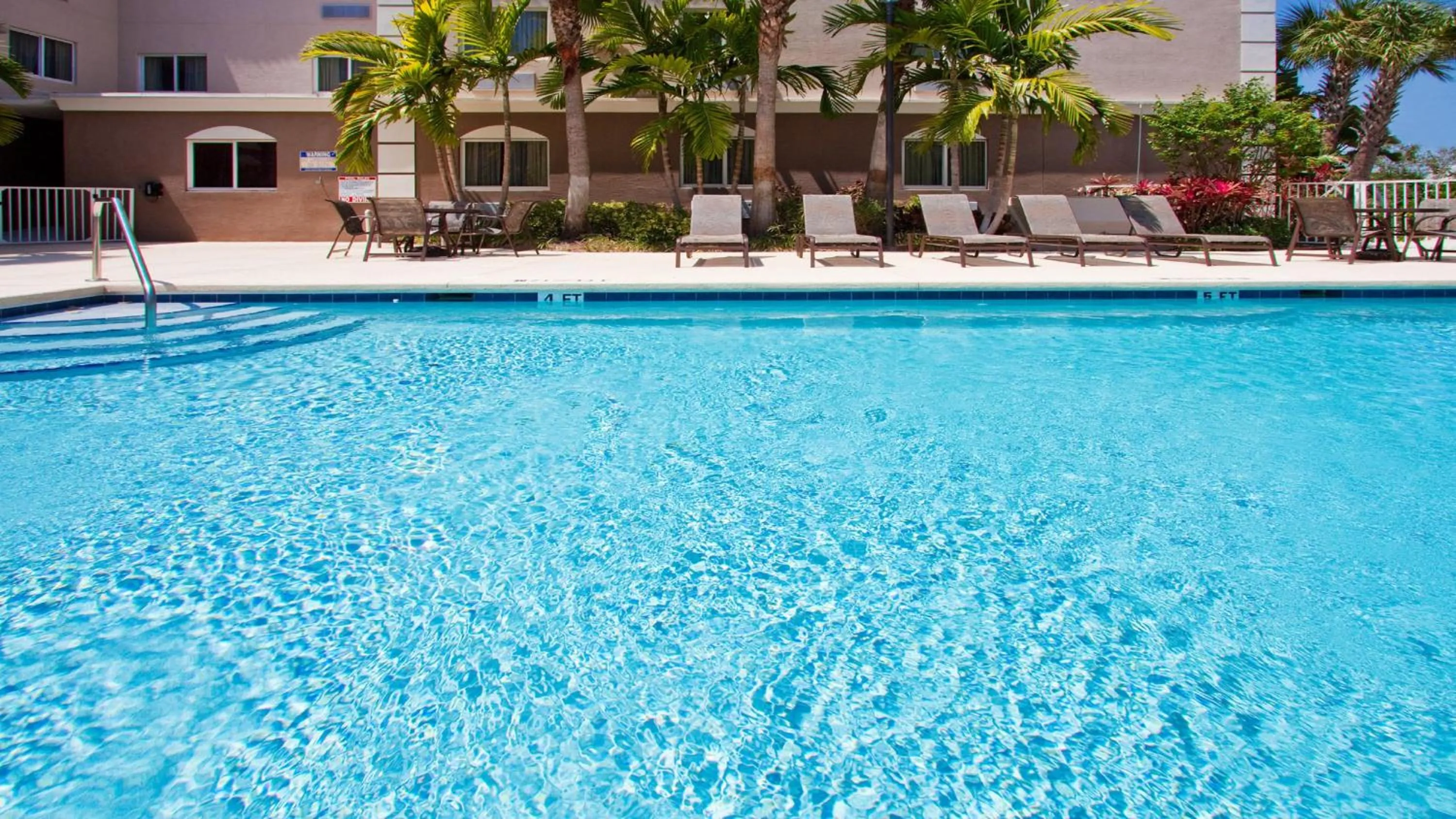 Swimming pool in Holiday Inn Express West Palm Beach Metrocentre by IHG