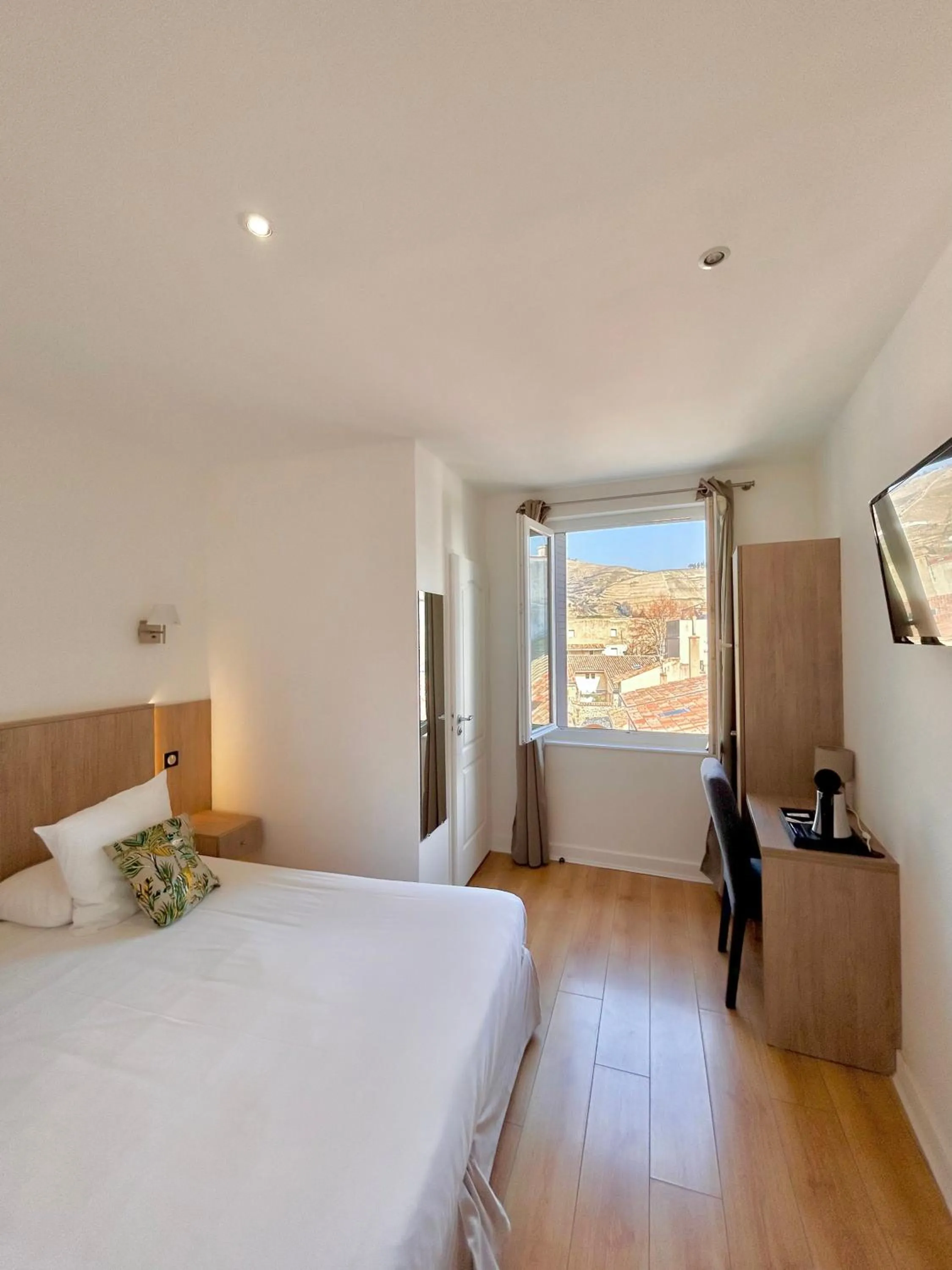 Photo of the whole room, Bed in Hôtel Les Deux Coteaux