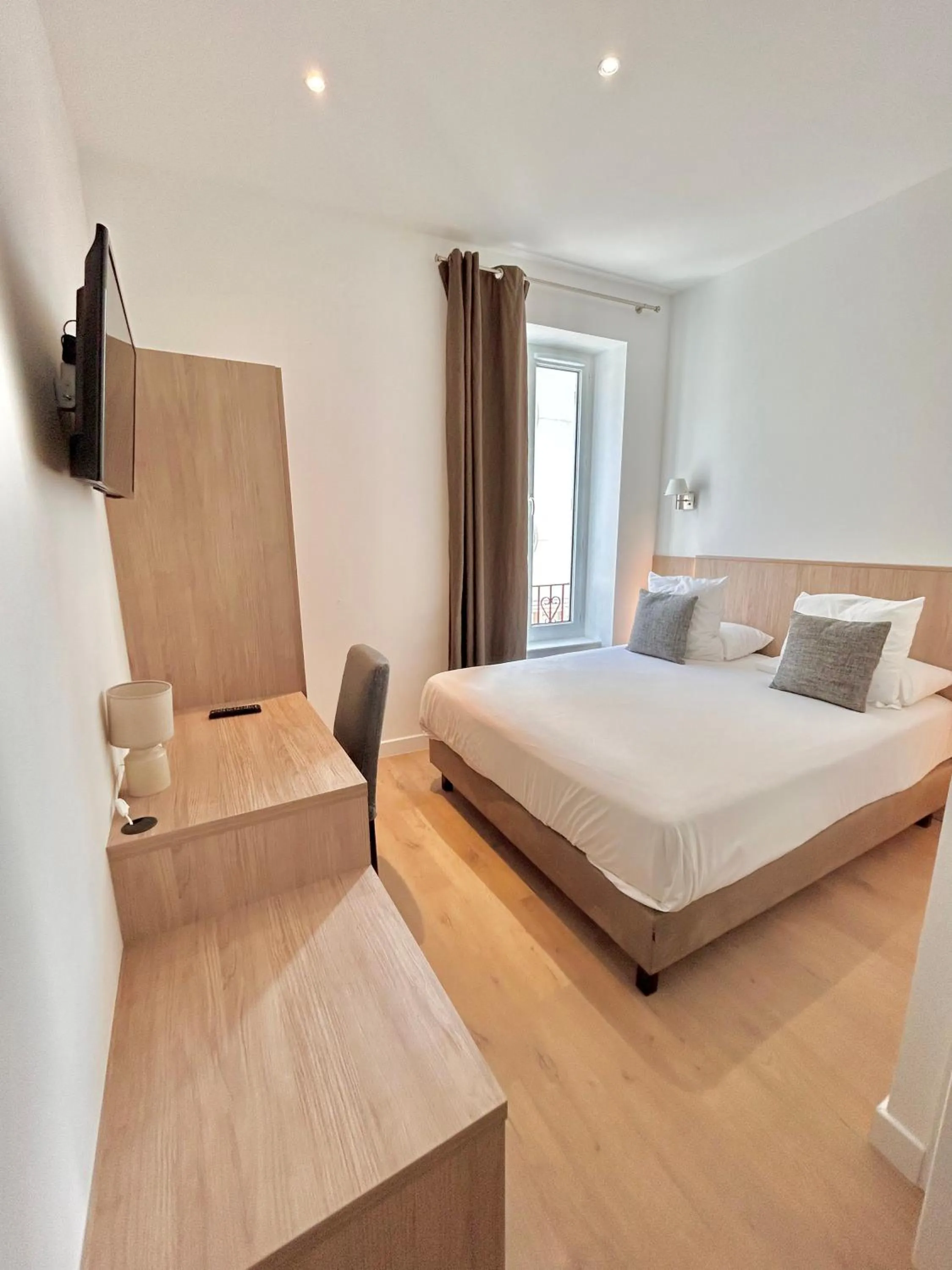 Photo of the whole room, Bed in Hôtel Les Deux Coteaux