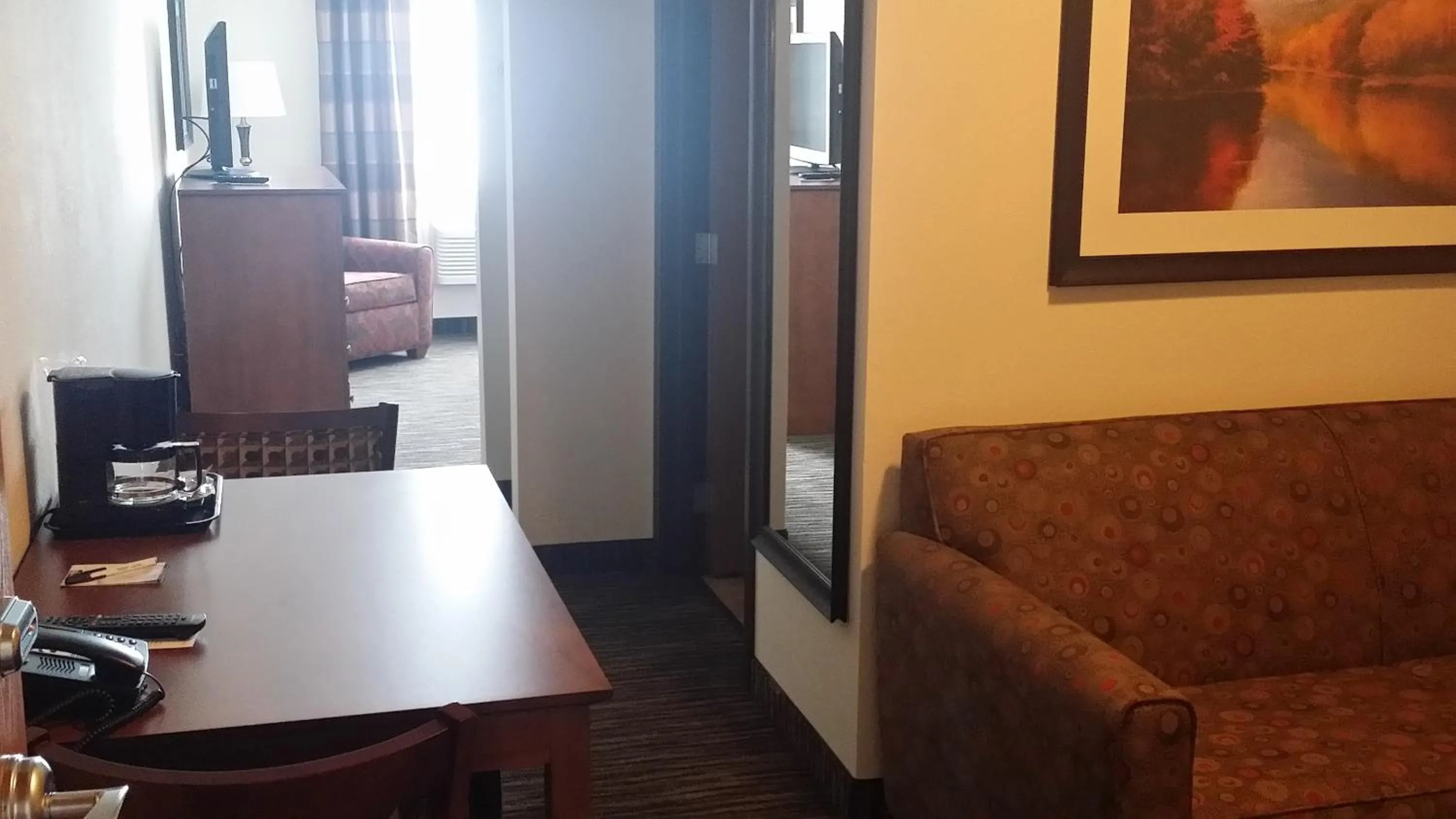 Bed in American Inn & Suites