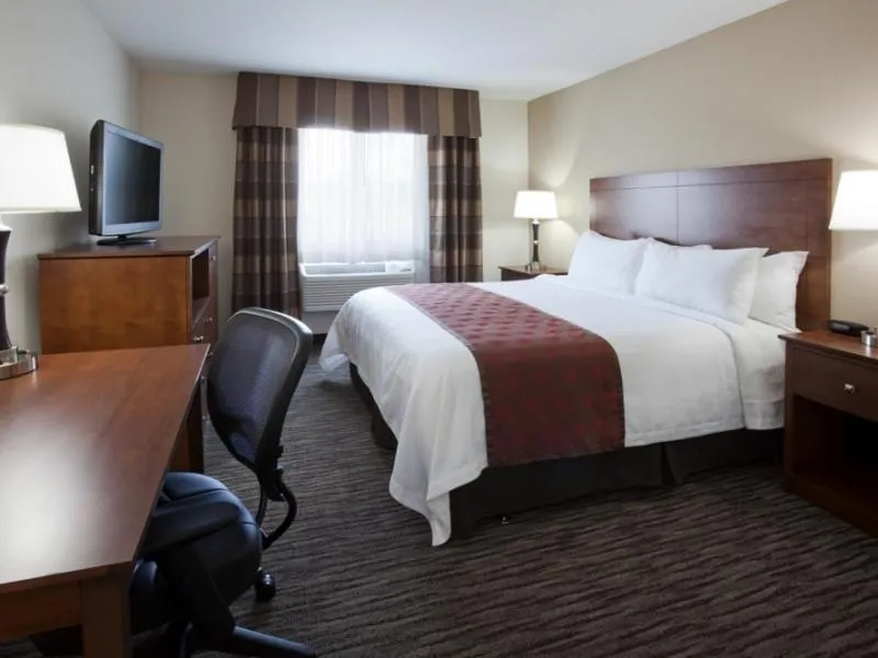 Bed in American Inn & Suites