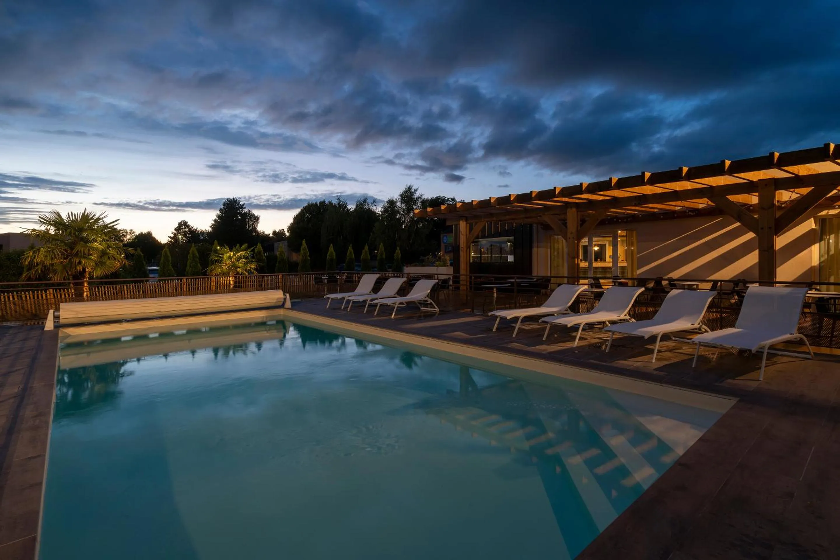 Swimming pool in Sure Hotel by Best Western Caen Memorial