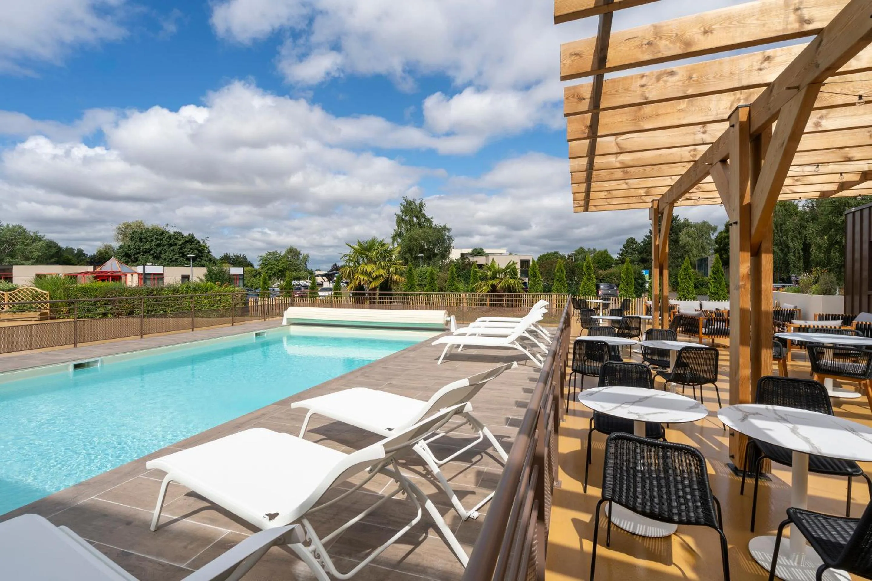 Swimming pool in Sure Hotel by Best Western Caen Memorial