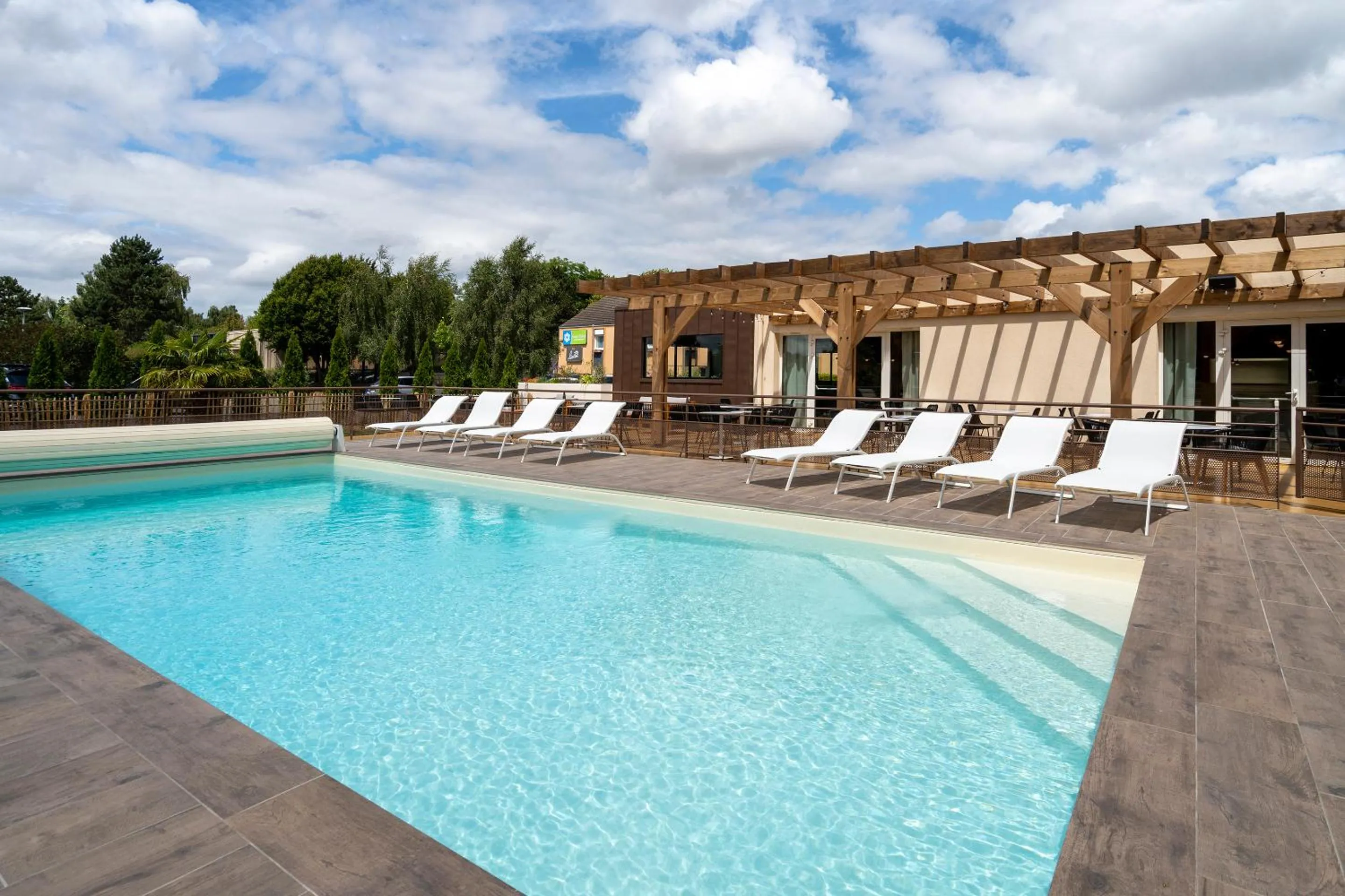 Swimming pool in Sure Hotel by Best Western Caen Memorial