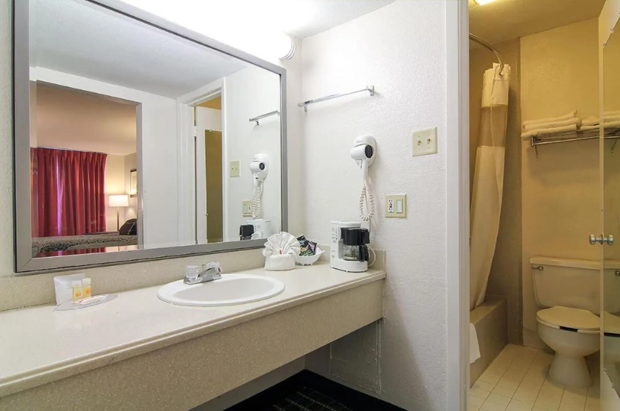 Bathroom in Days Inn by Wyndham Market Center Dallas Love Field