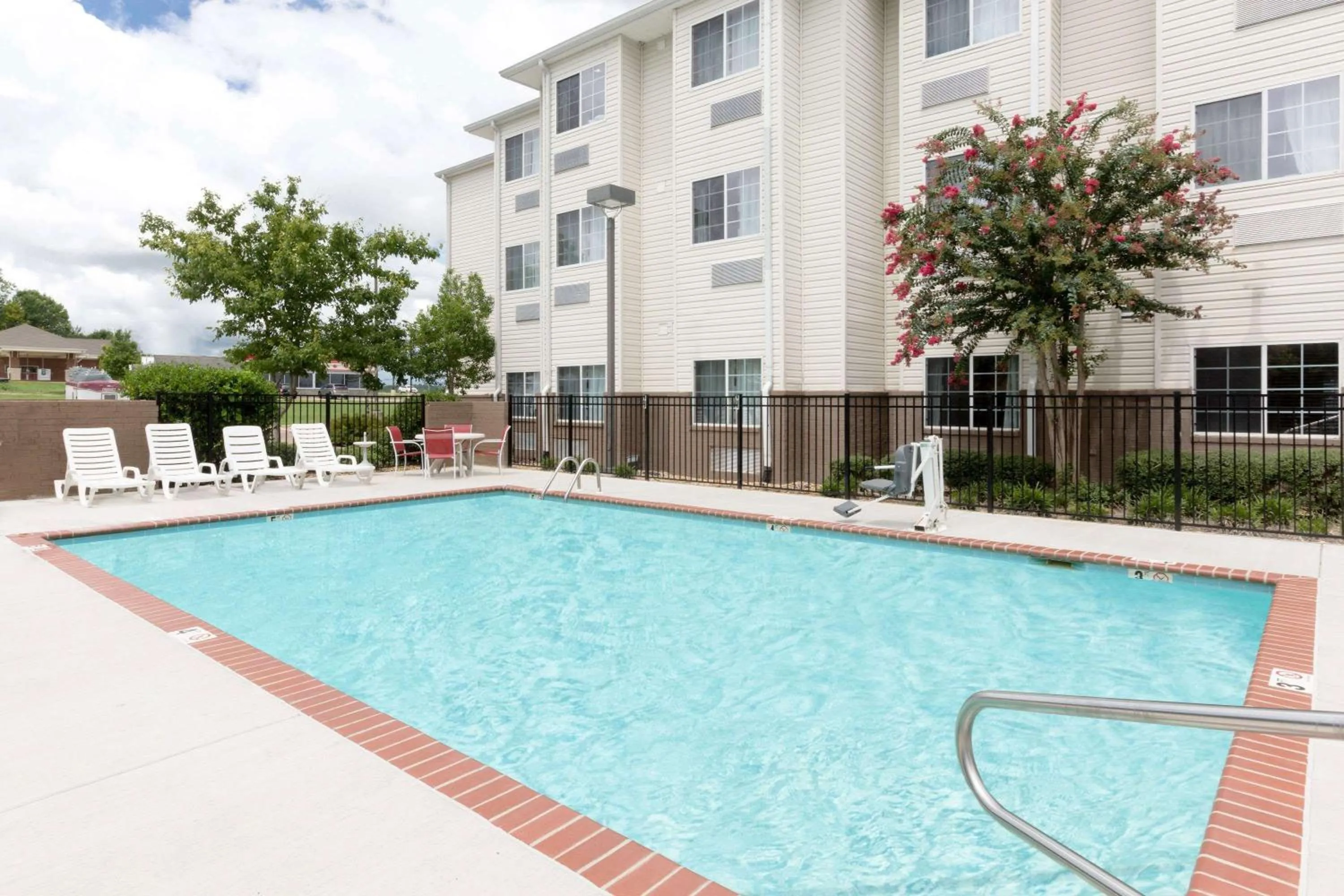 Property building, Swimming Pool in Microtel Inn & Suites by Wyndham Starkville