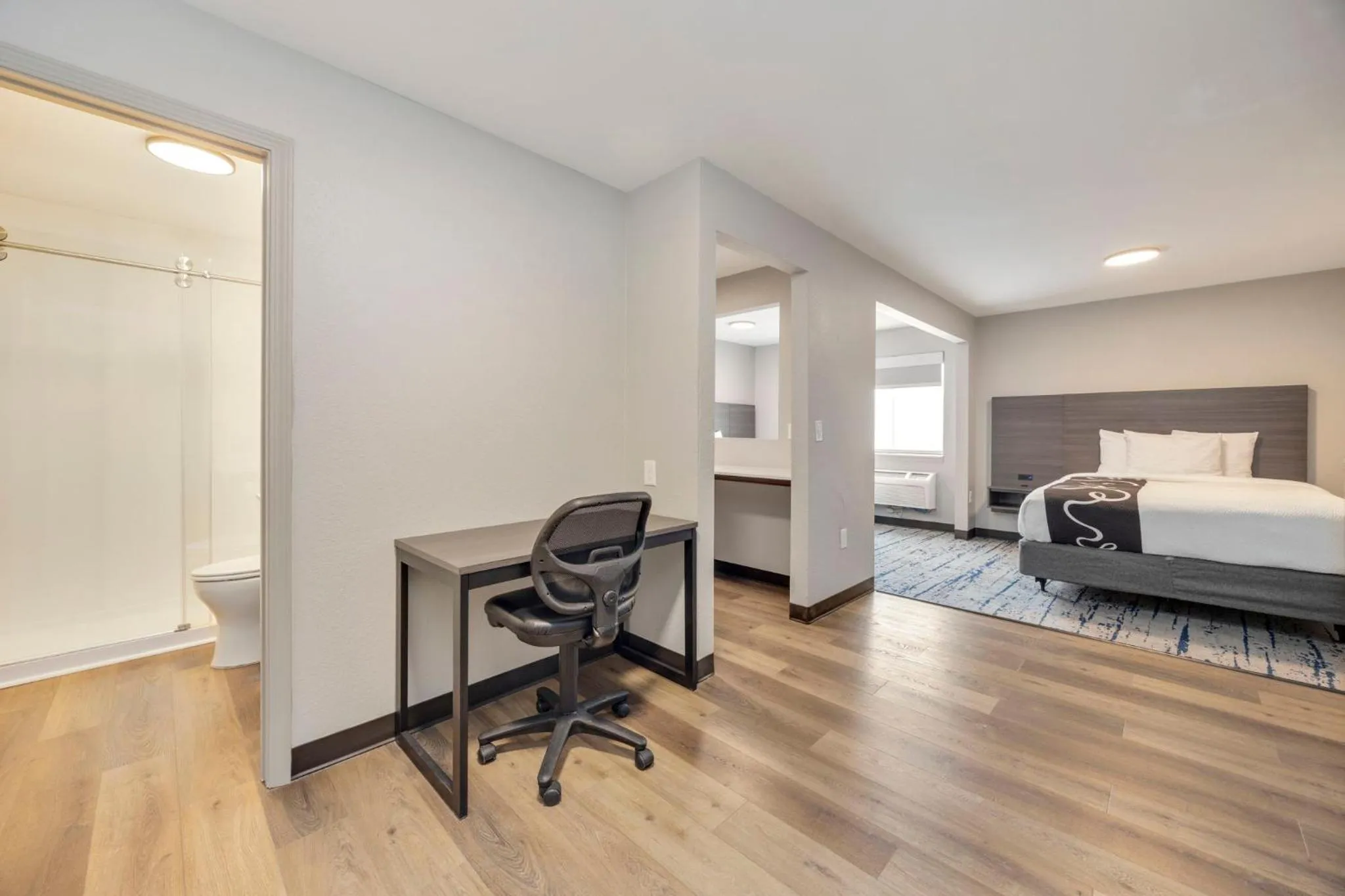 Living room, Bed in HomeStay Suites