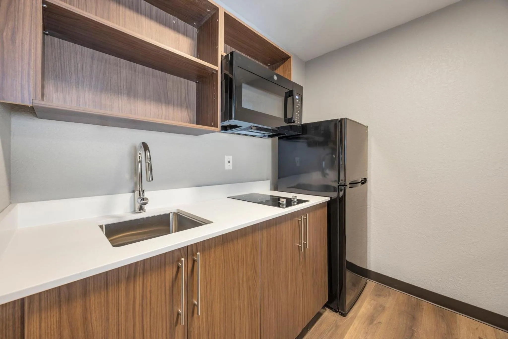 Kitchen or kitchenette in HomeStay Suites