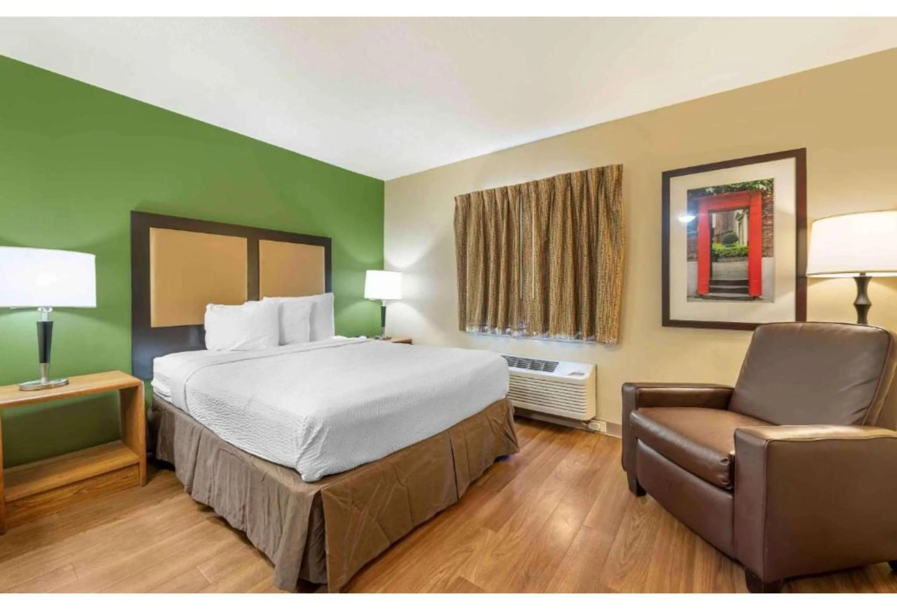 Bedroom, Bed in Studio 6 Suites Greenville, SC - Haywood Mall