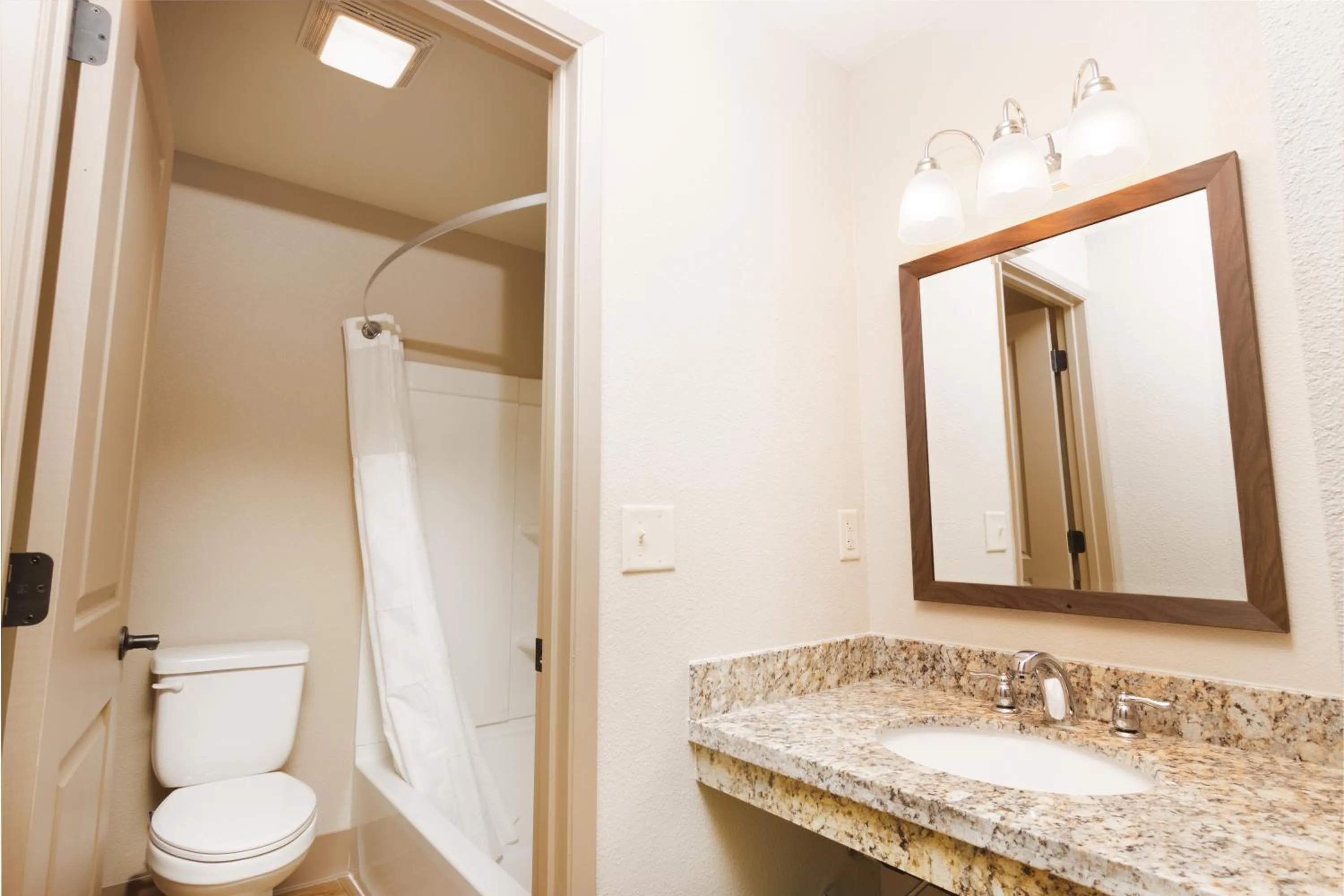 Toilet in Super 8 by Wyndham Fallon