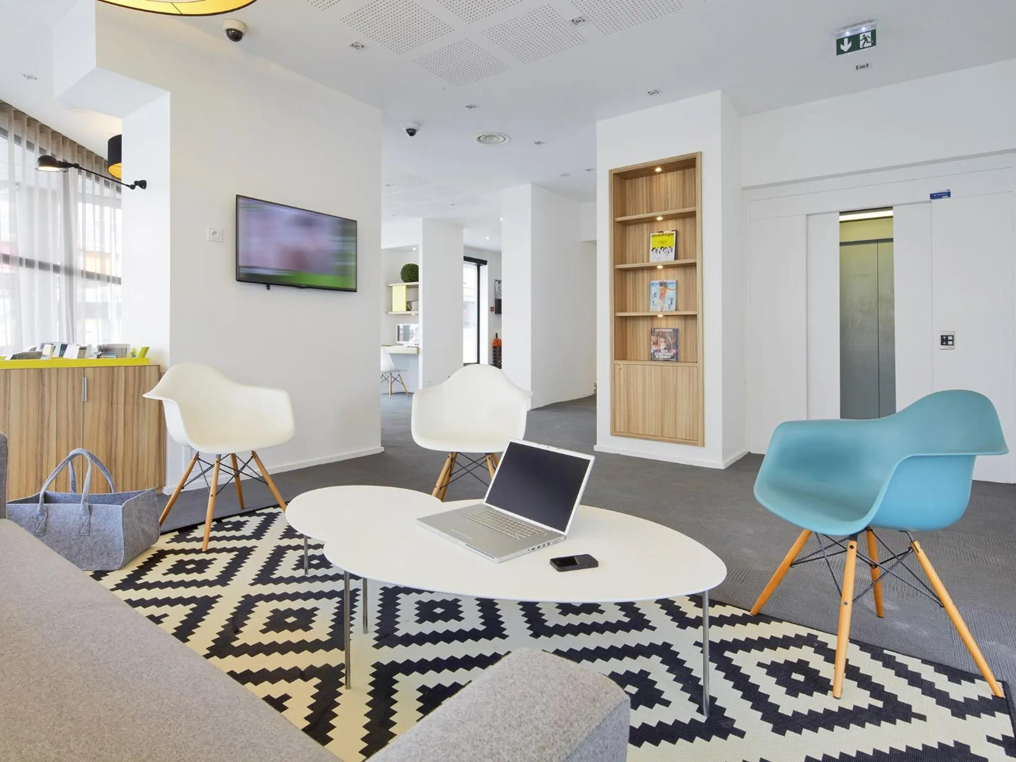 Communal lounge/ TV room in Kyriad Hotel Brest