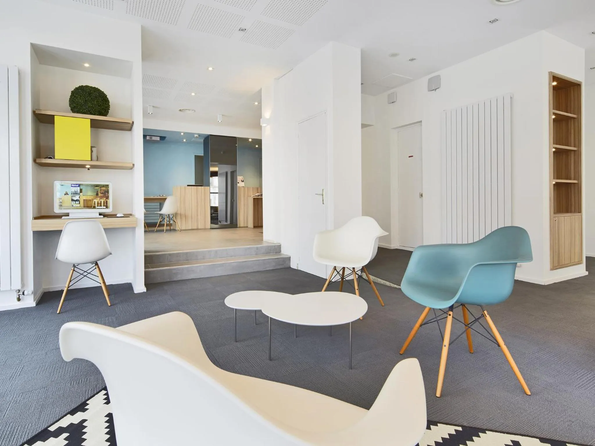 Communal lounge/ TV room in Kyriad Hotel Brest