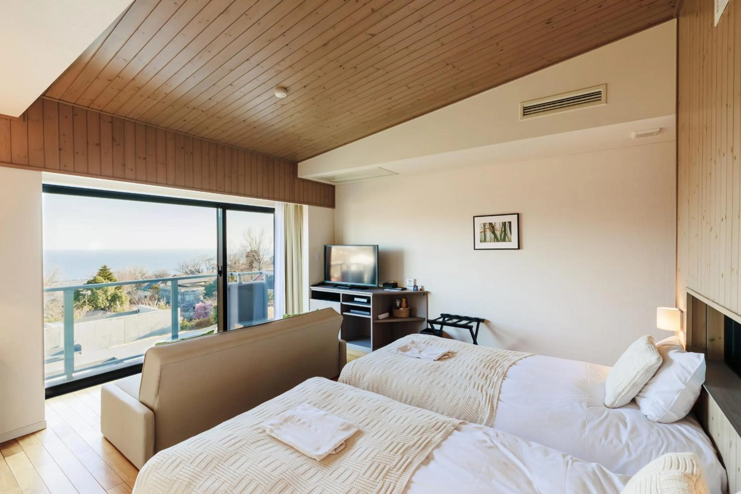 Bed in the salon 伊豆高原 Hotels & Resort