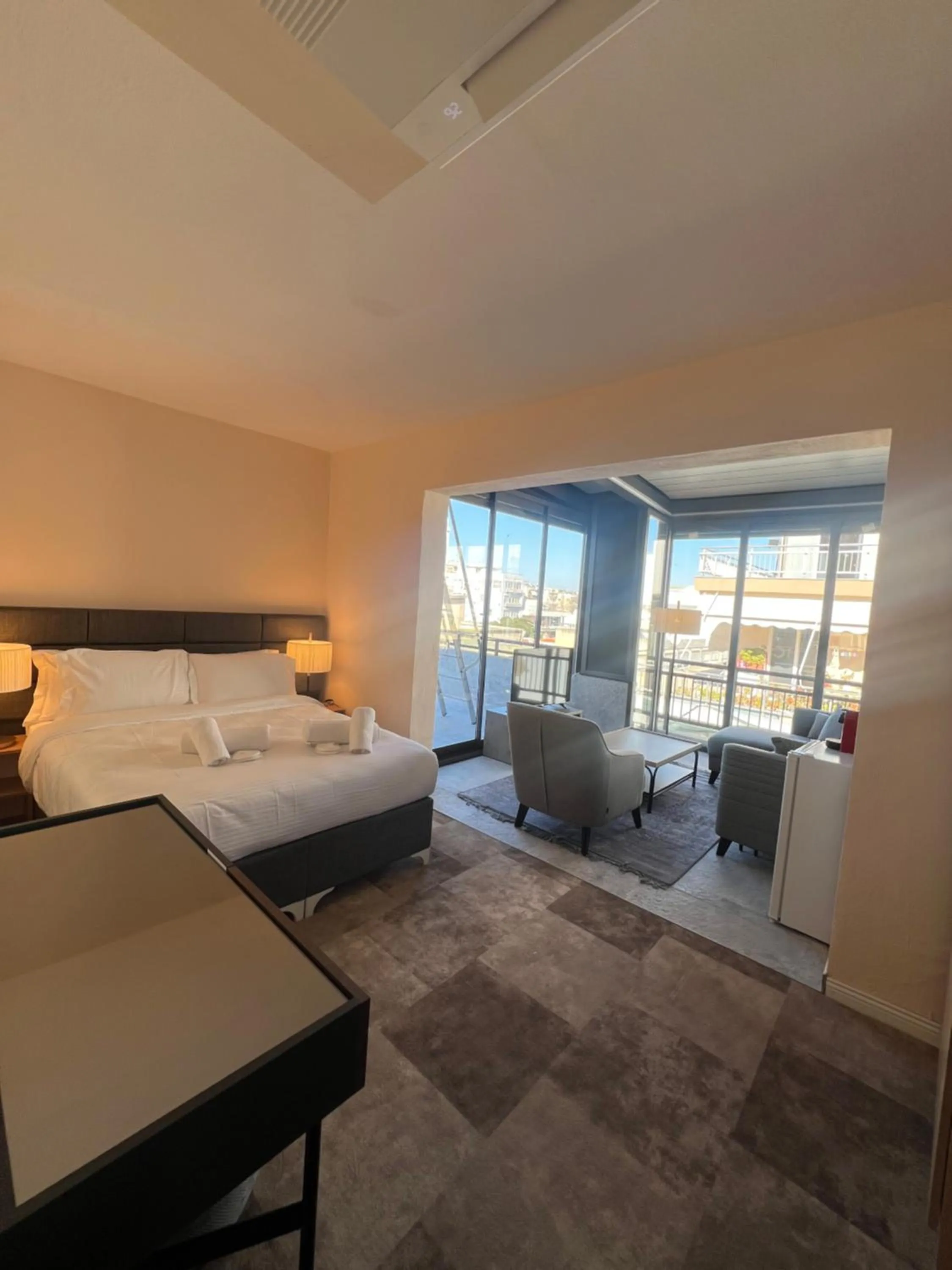 Seating area, Bed in Lighthouse Hotel