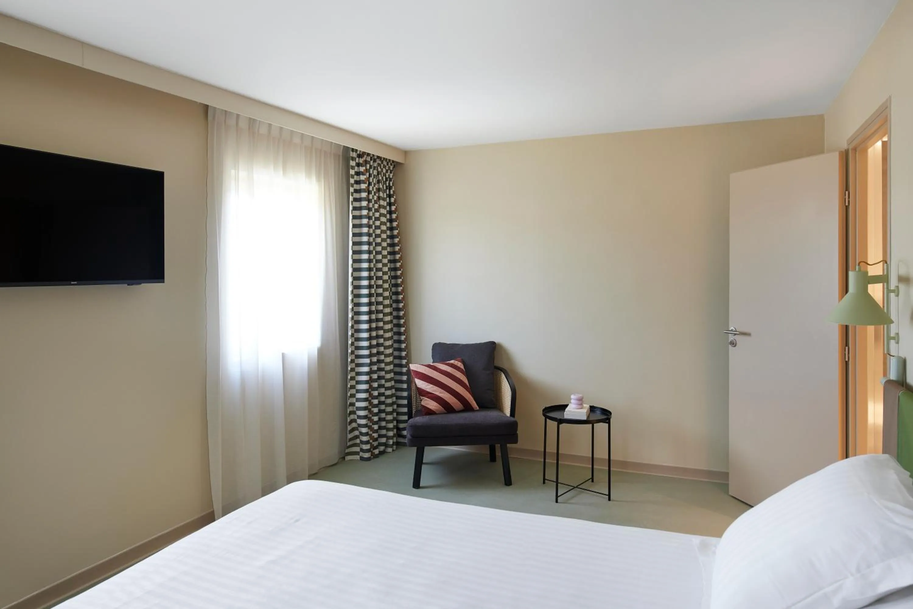 Living room, Bed in Kyriad Hotel Cannes Mandelieu