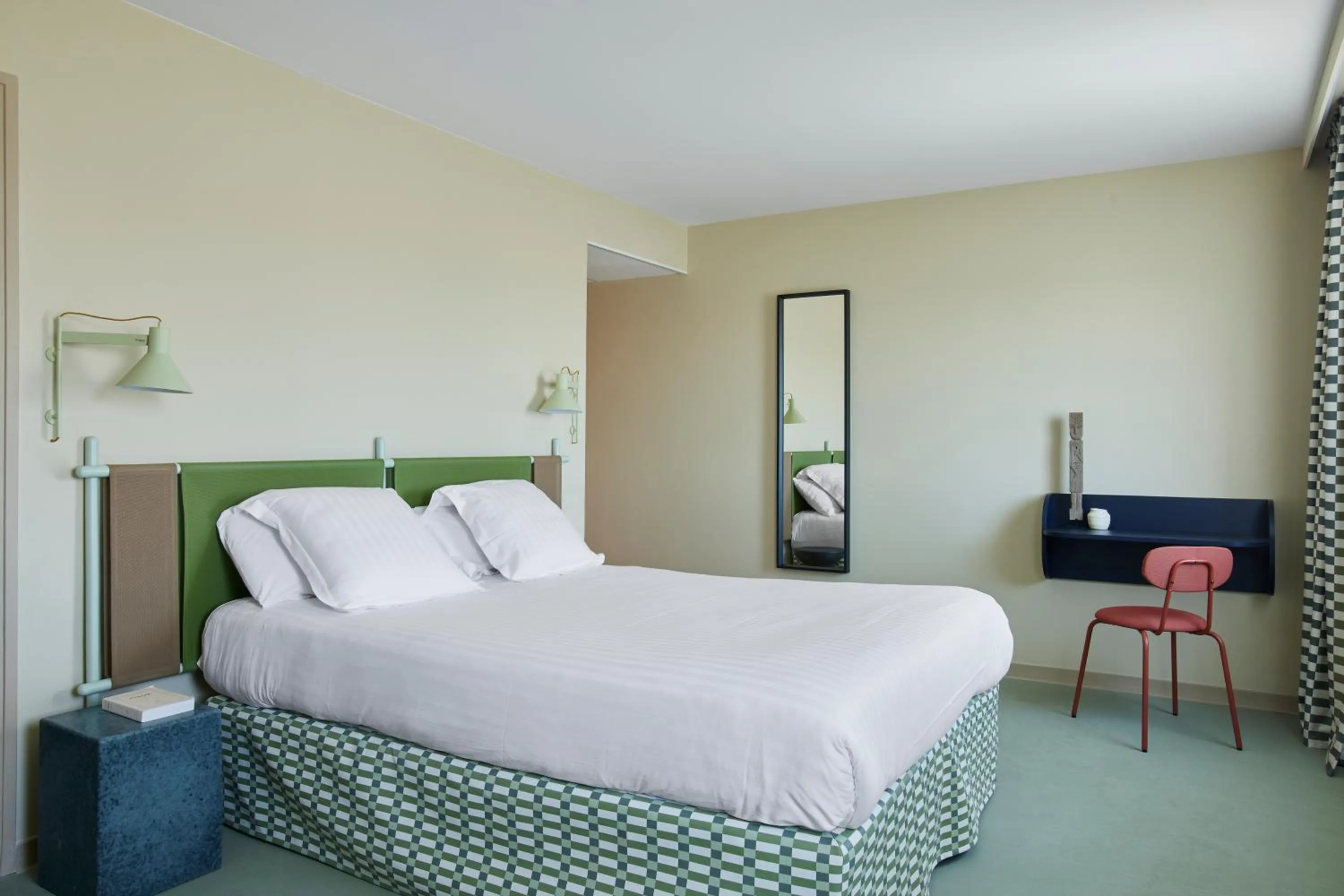 Bed in Kyriad Hotel Cannes Mandelieu