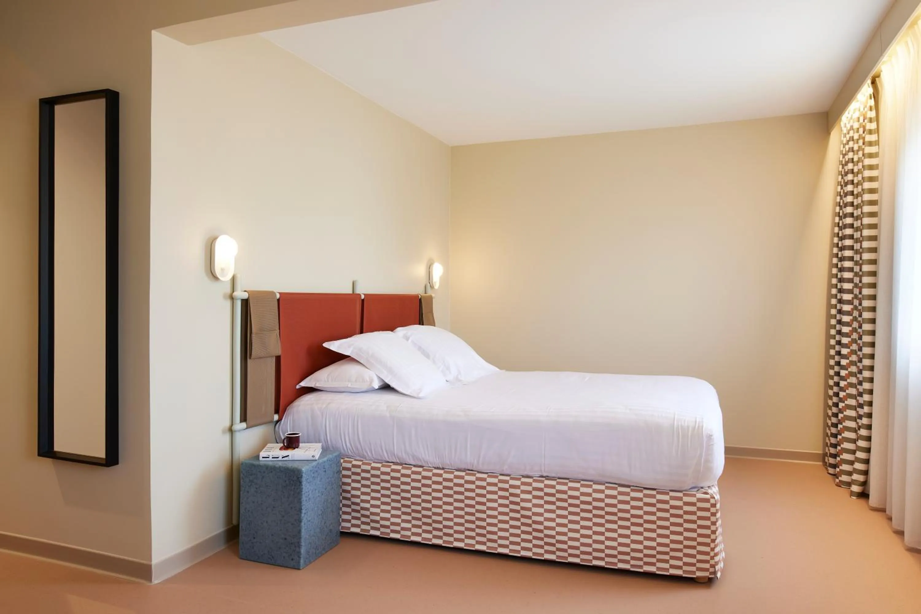 Bed in Kyriad Hotel Cannes Mandelieu