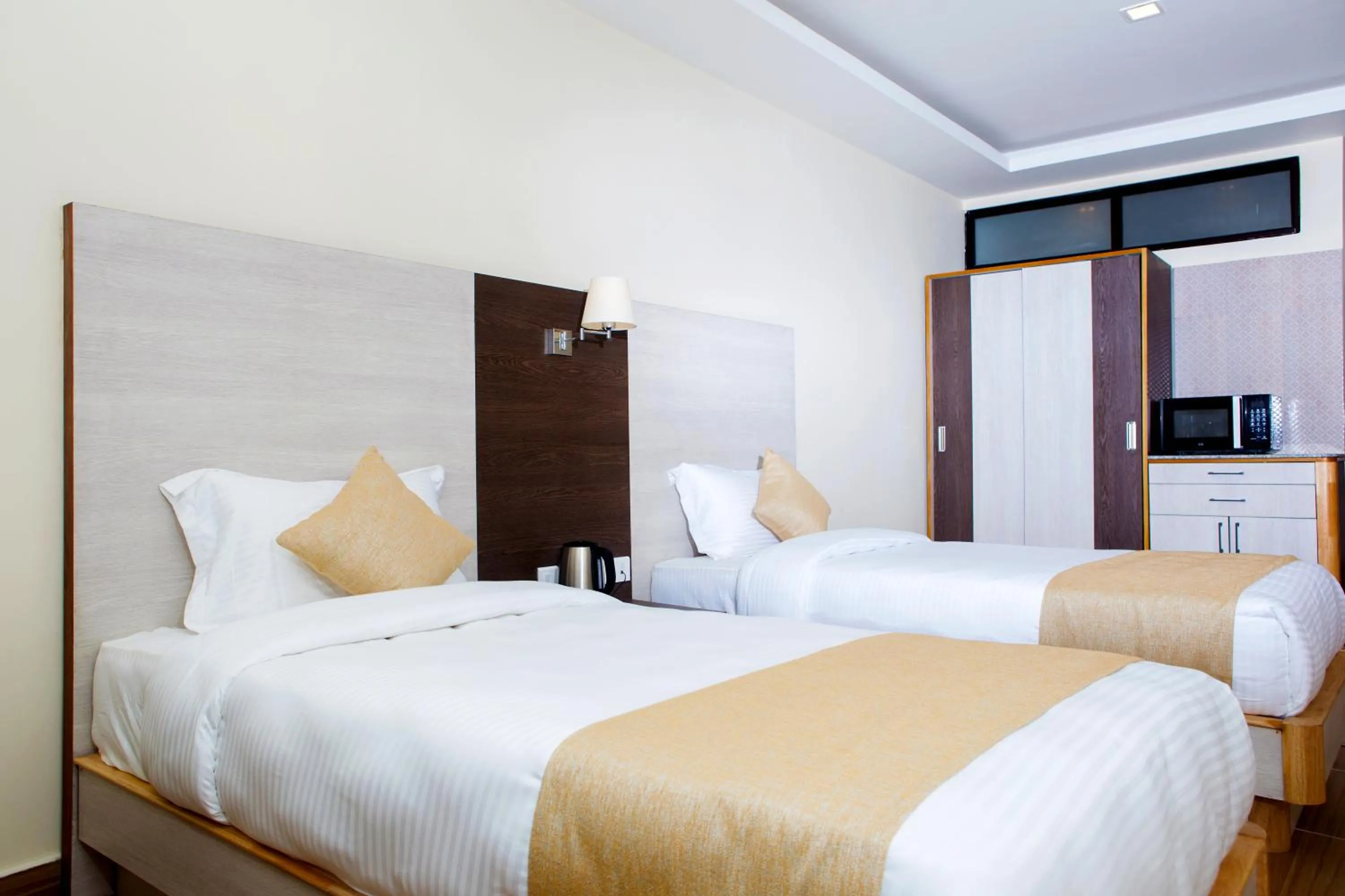 Bed in Sarovar Residency Serviced Apartment Hotel