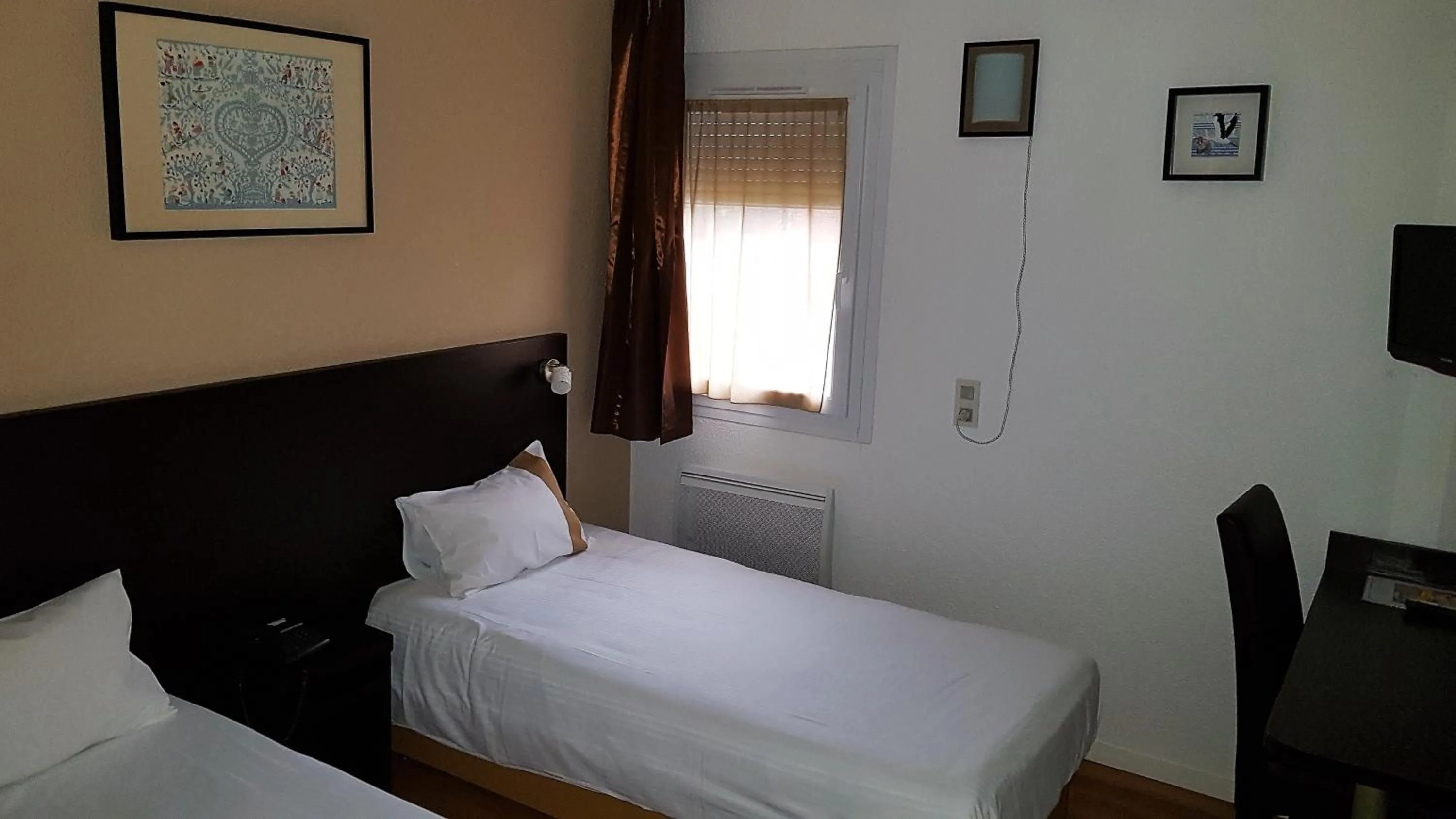 Bed in Hôtel d'Alsace