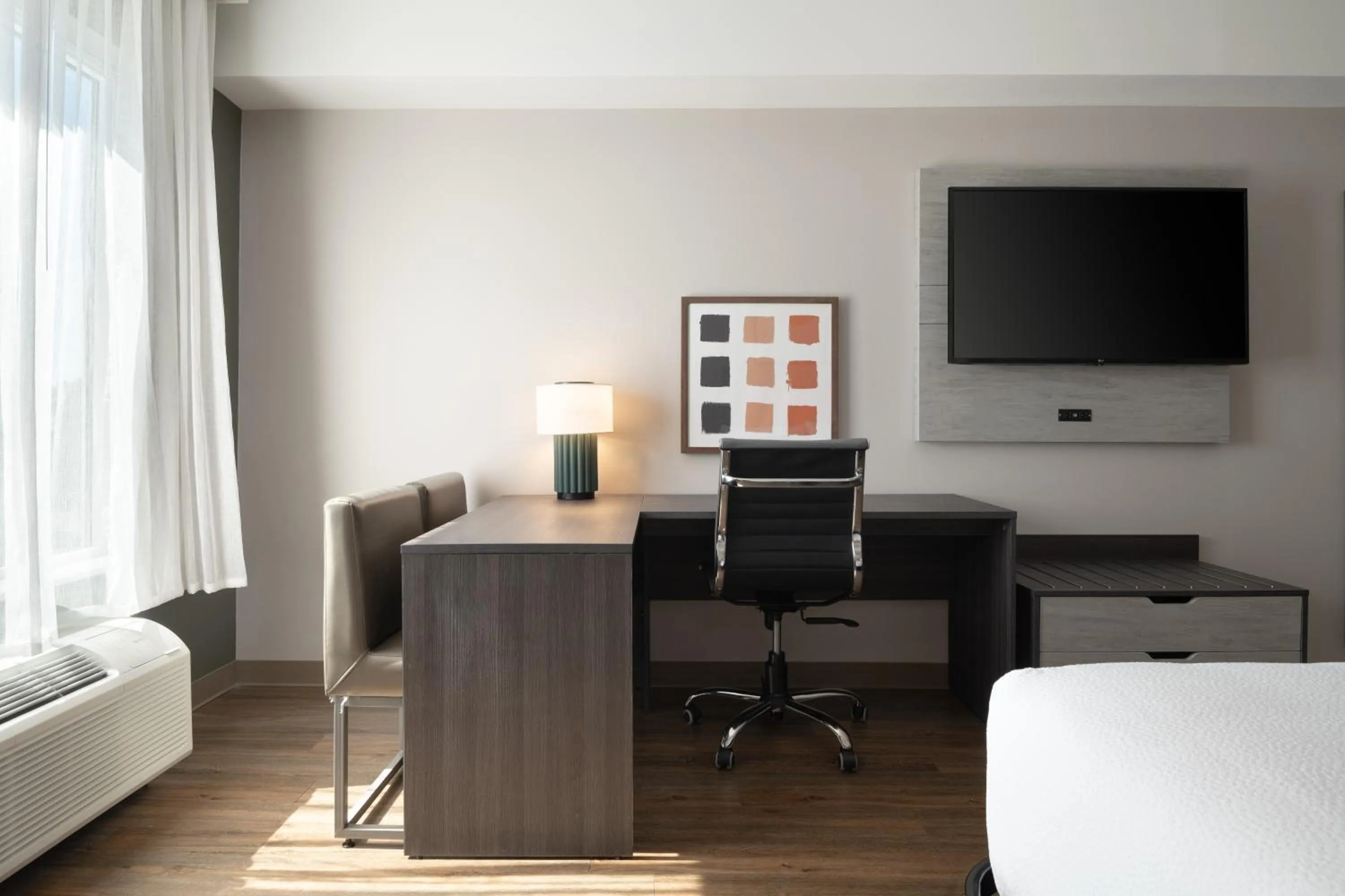 Seating area, Bed in Spark by Hilton Destin