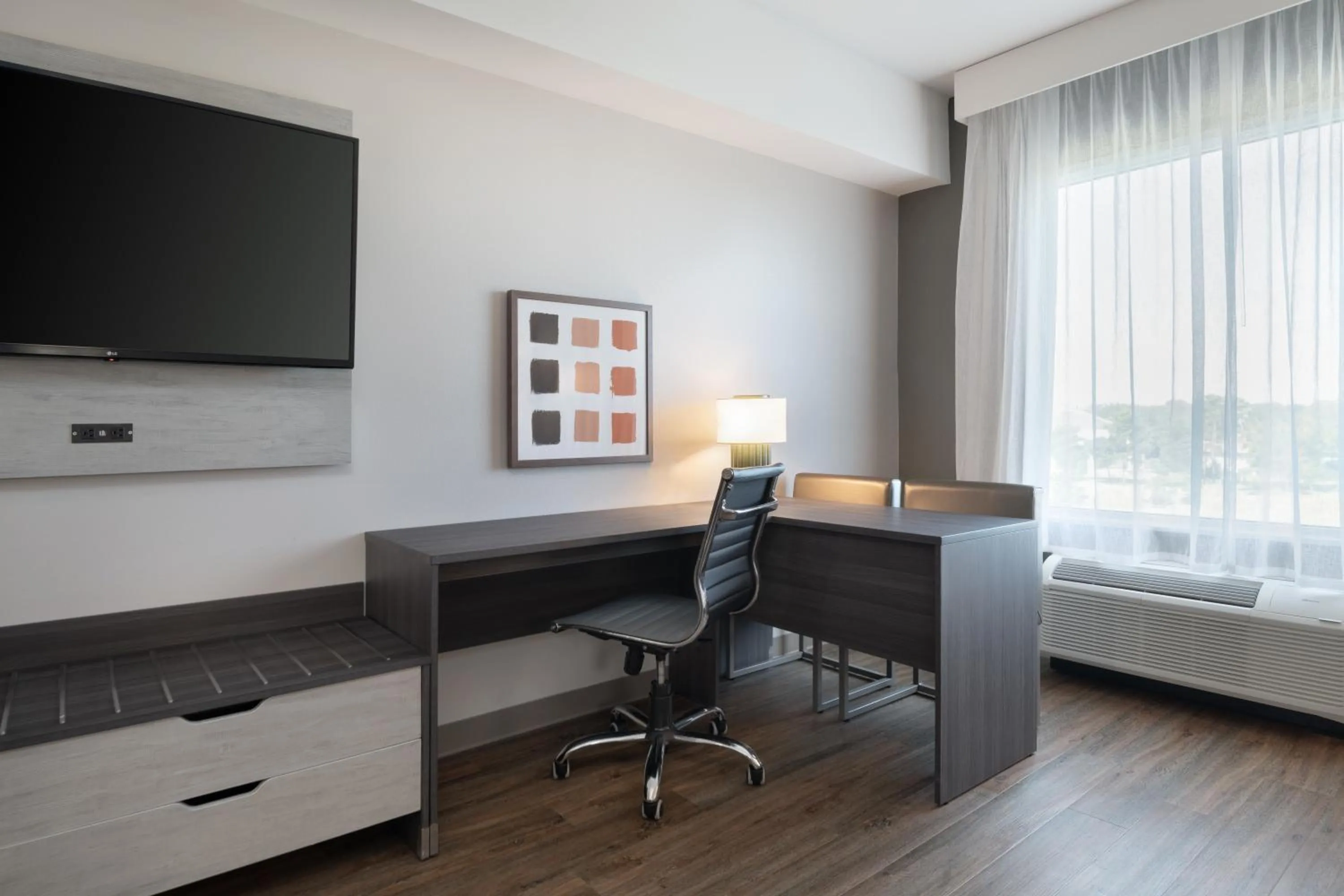 Seating area, Bed in Spark by Hilton Destin