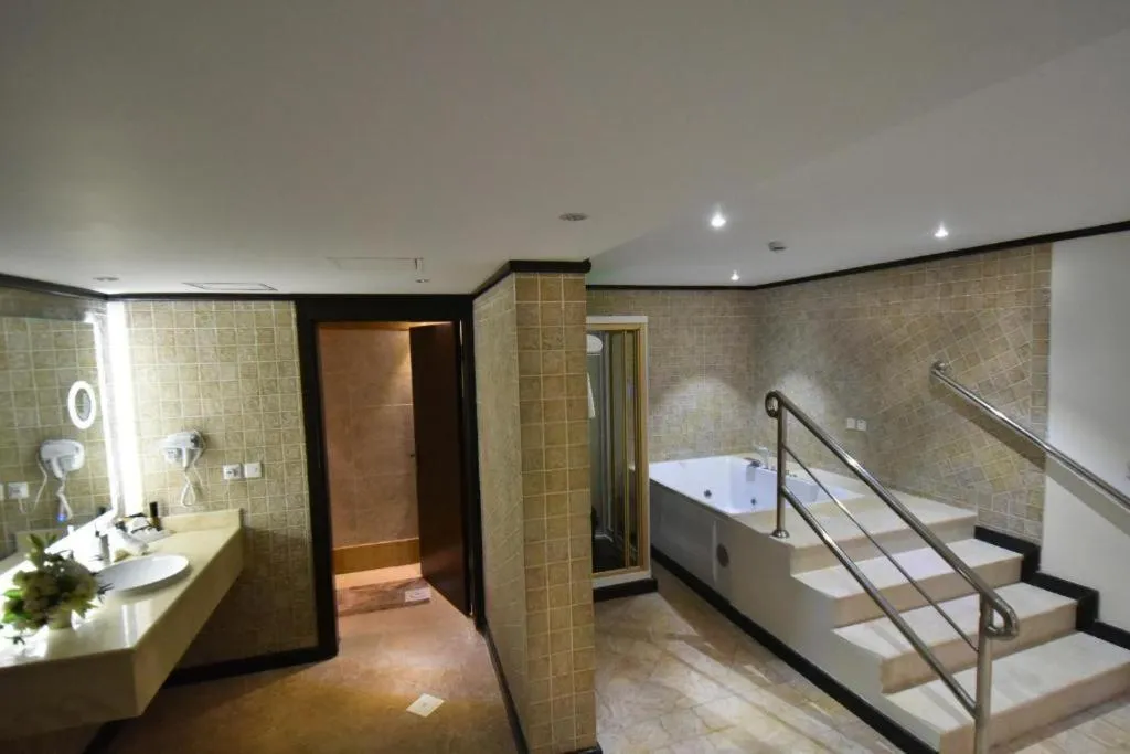 Bathroom, Bed in The District Hotel Najran