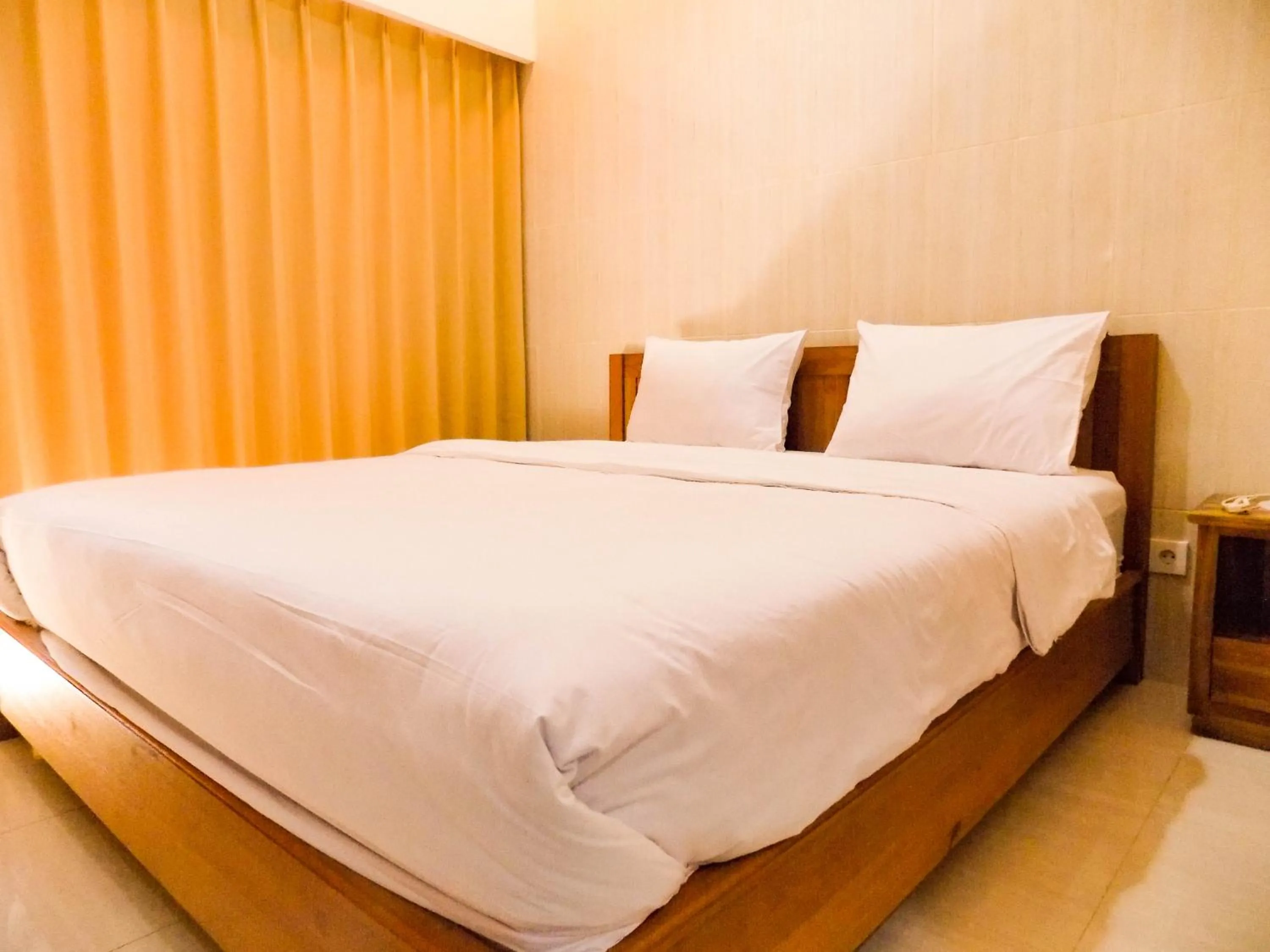 Bedroom, Bed in Guna Graha Kuta by Kamara