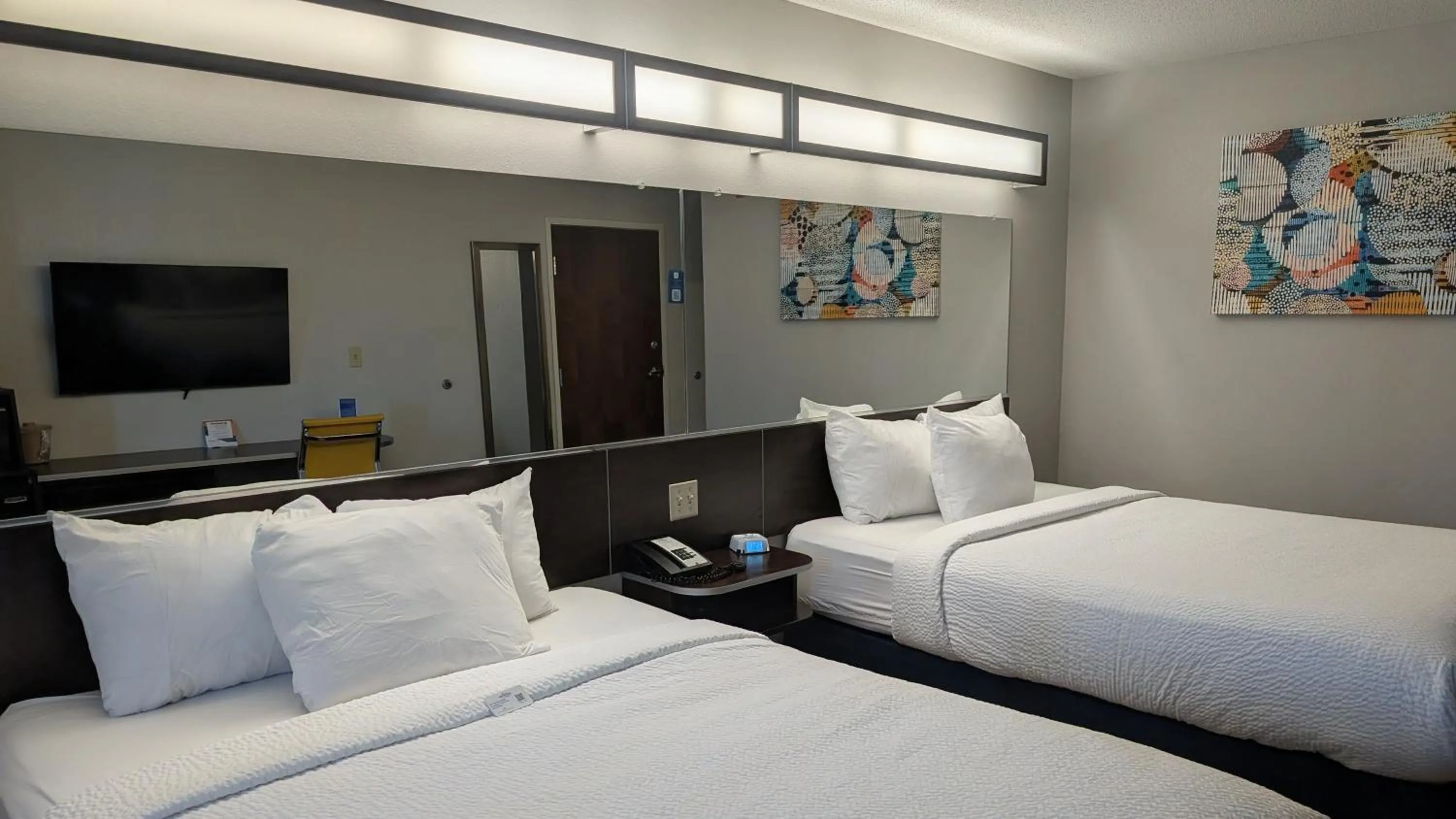 Bed in Microtel Inn & Suites by Wyndham Wheeling at The Highlands