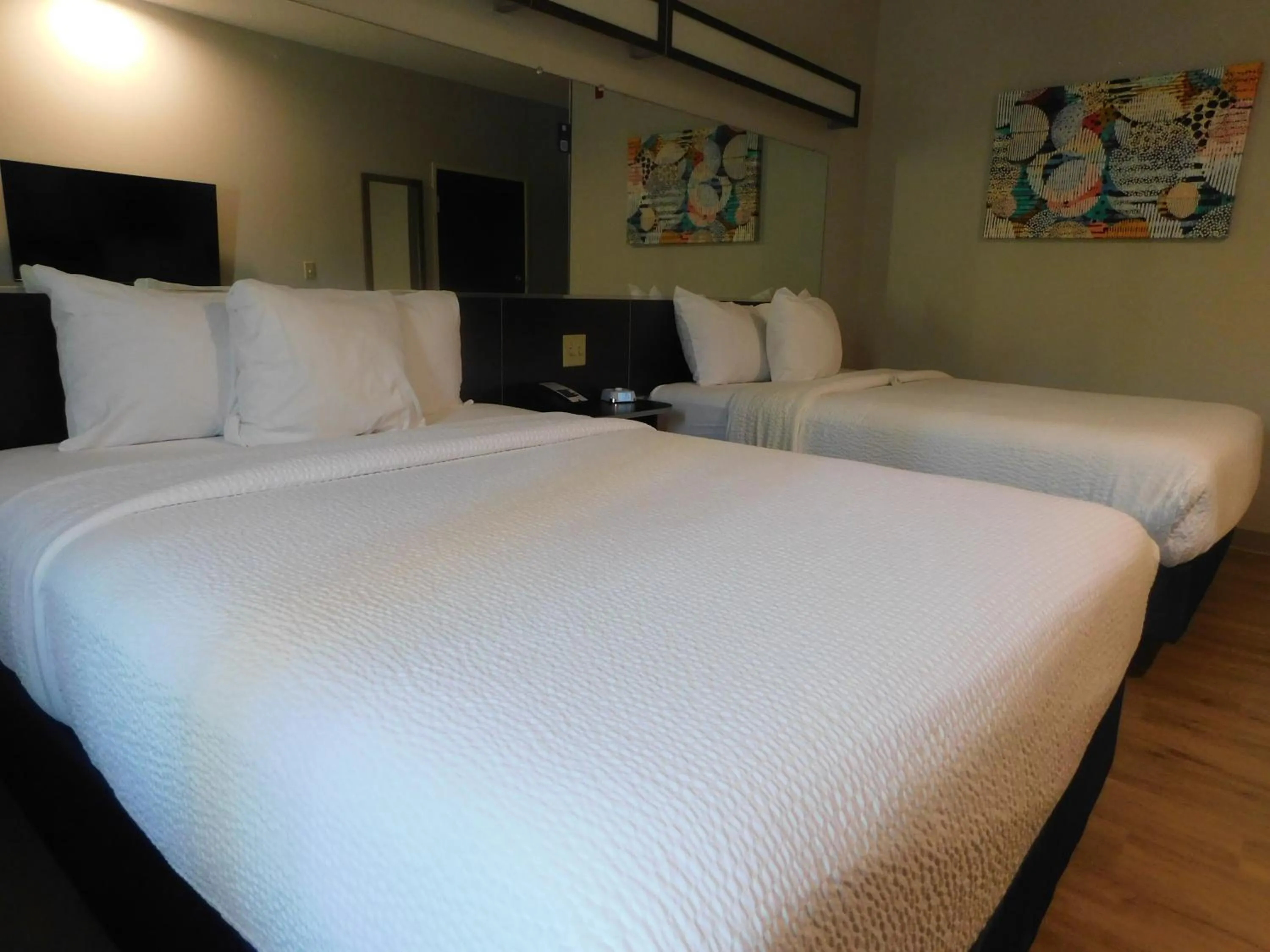 Bed in Microtel Inn & Suites by Wyndham Wheeling at The Highlands