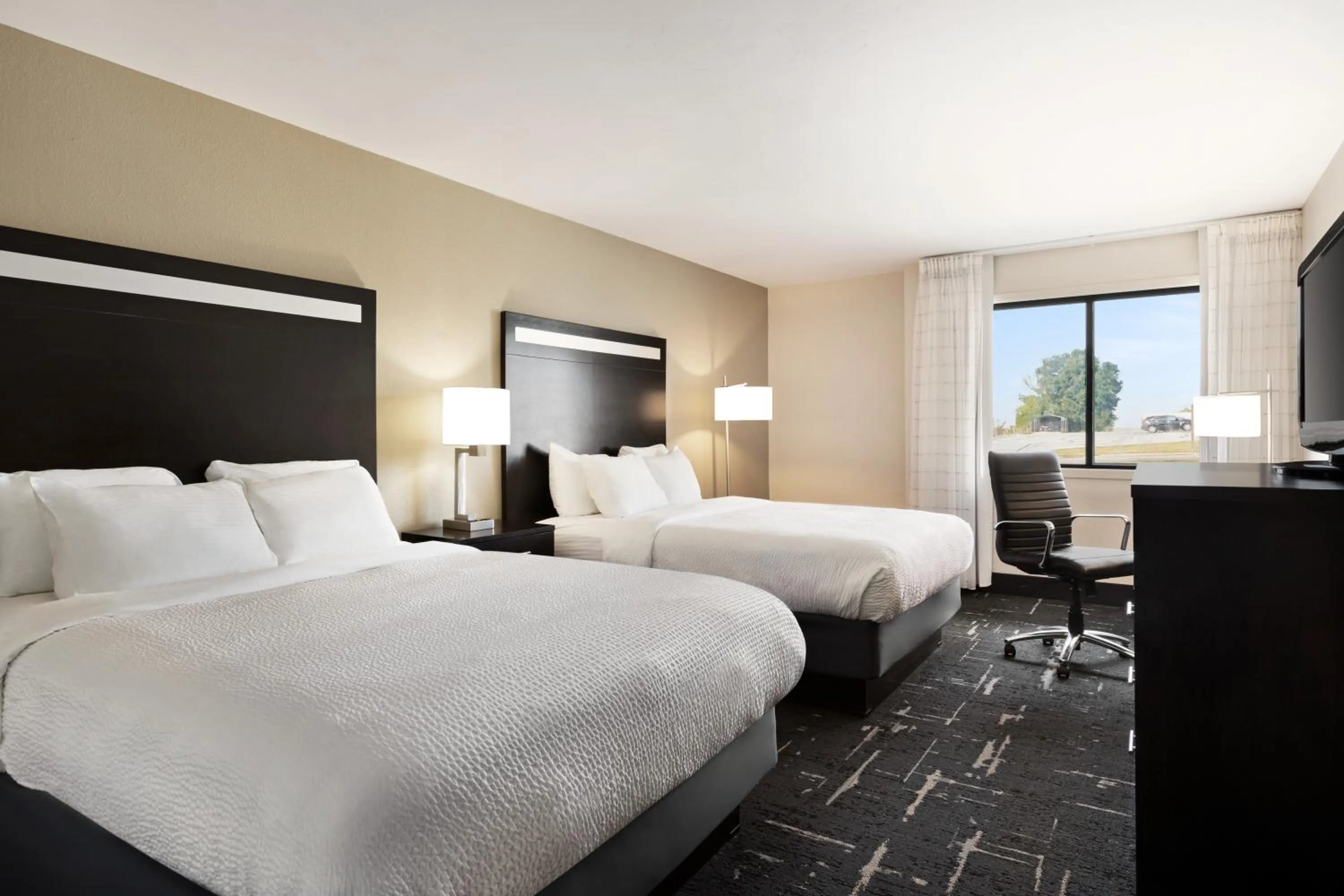 Bed in Carrollton Hotel