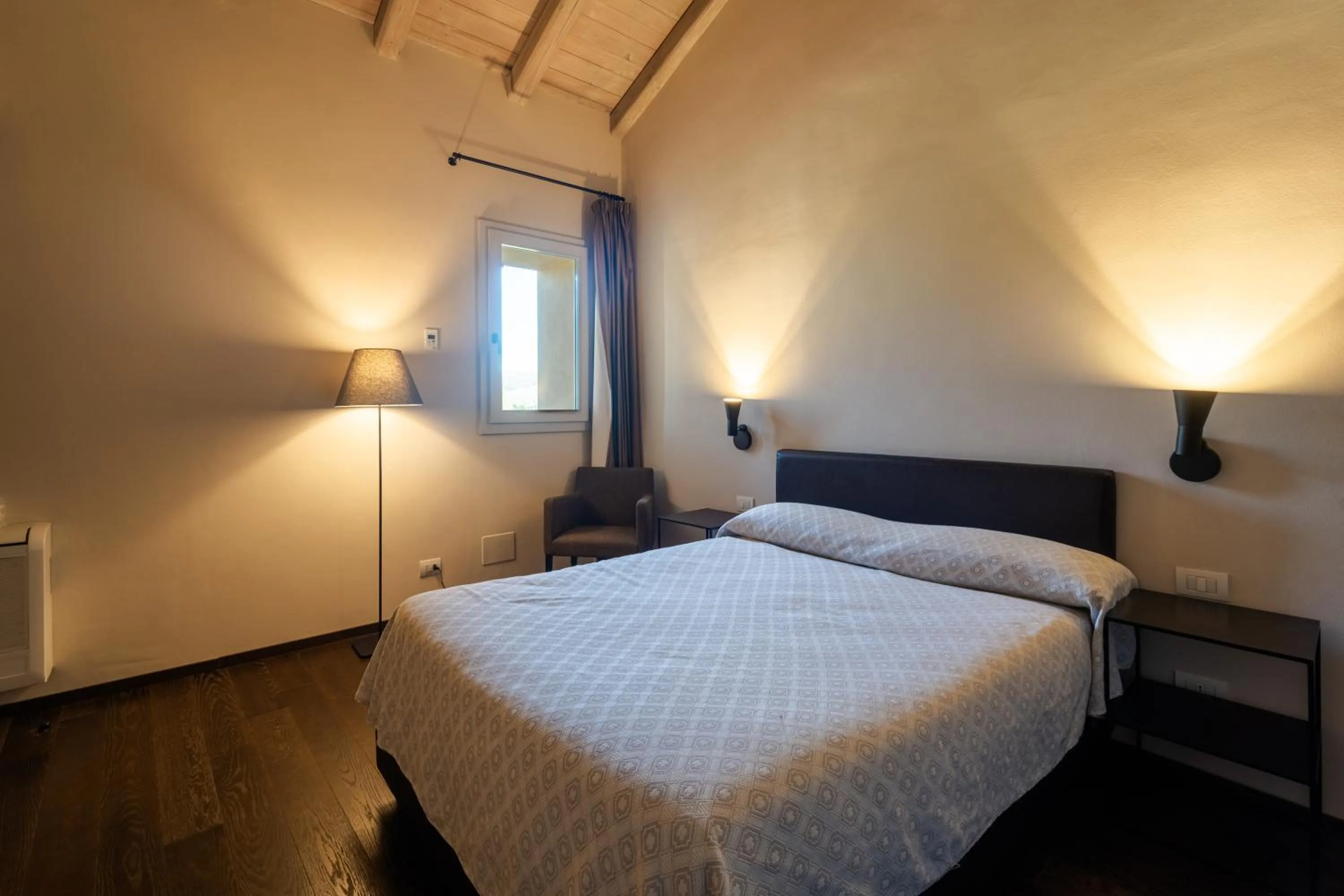 Bed in PALAZZO DE' ROSSI HOTEL