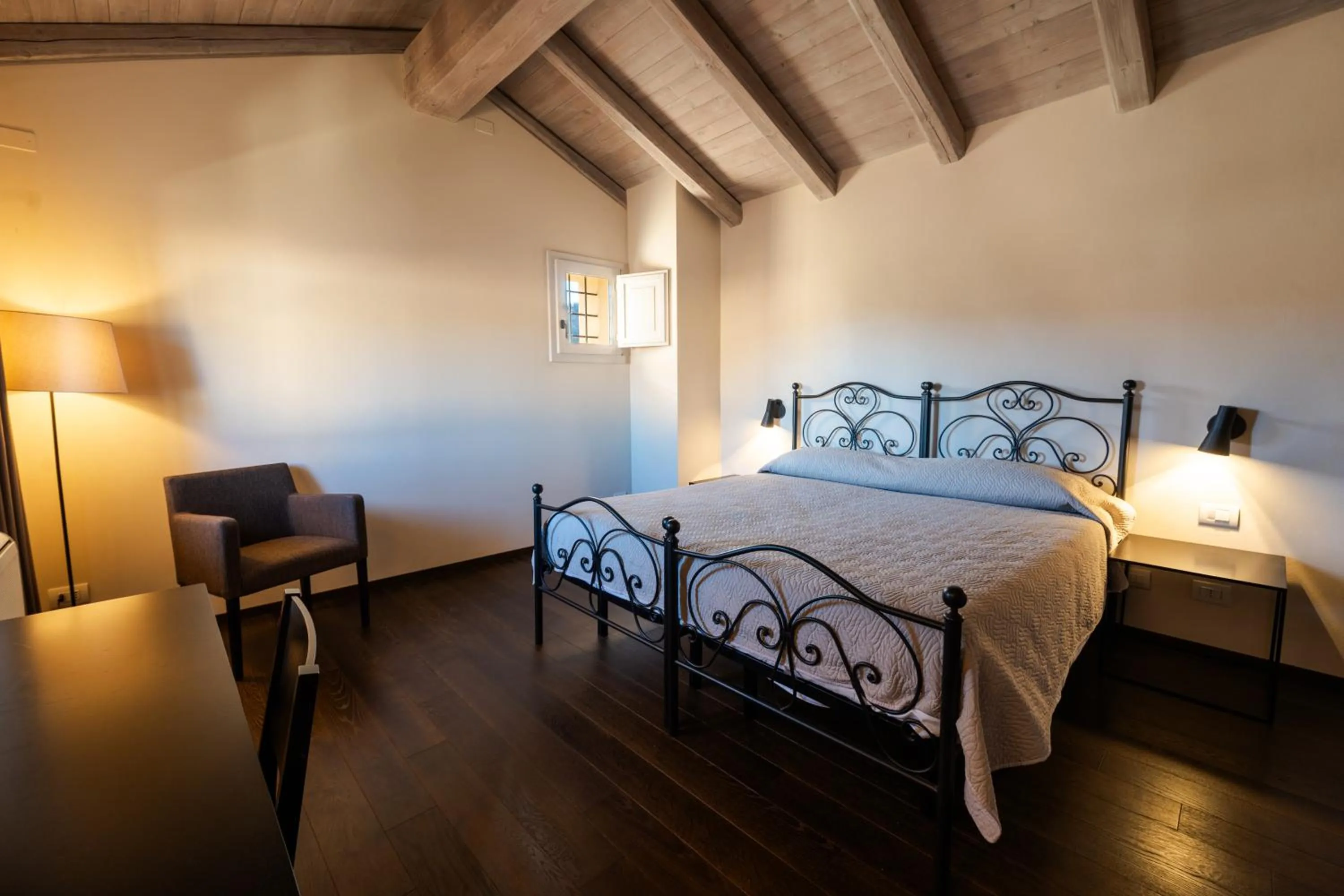 Bed in PALAZZO DE' ROSSI HOTEL