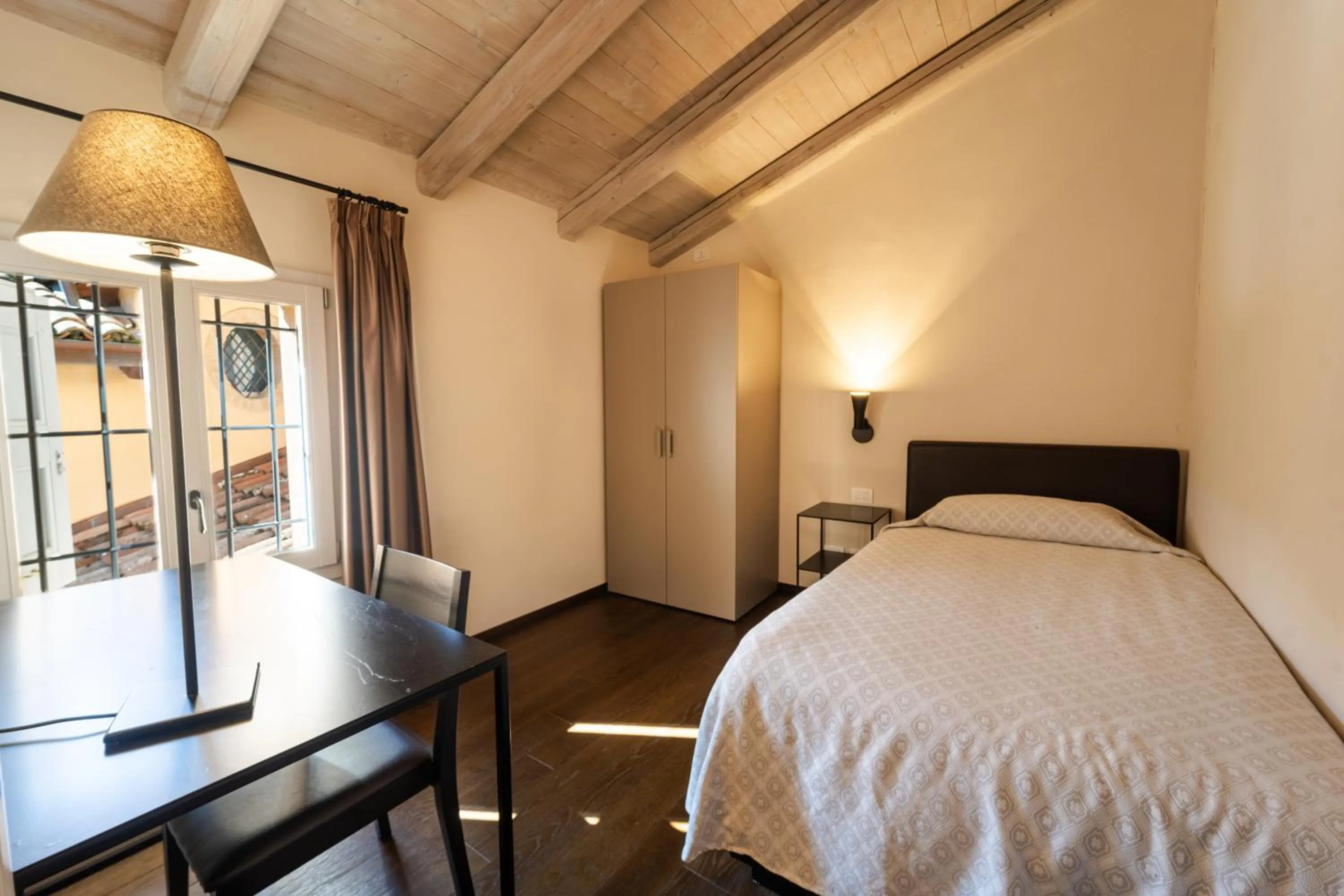 Bed in PALAZZO DE' ROSSI HOTEL