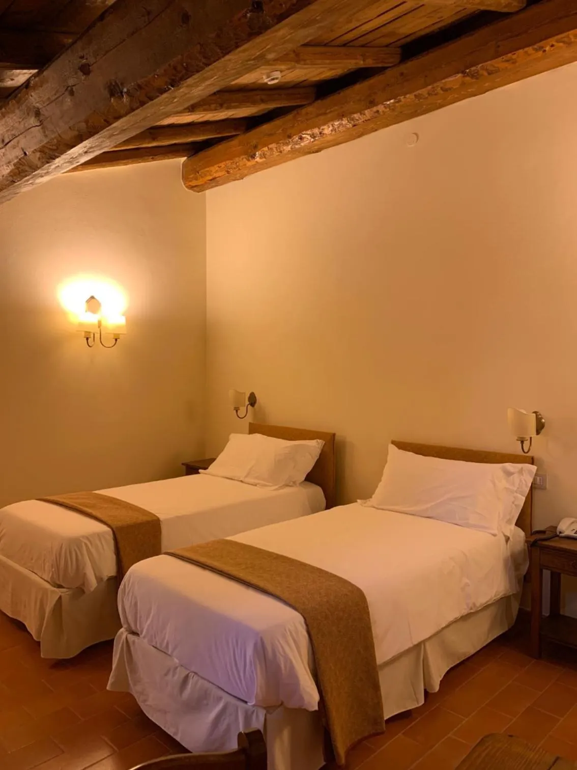 Bed in PALAZZO DE' ROSSI HOTEL