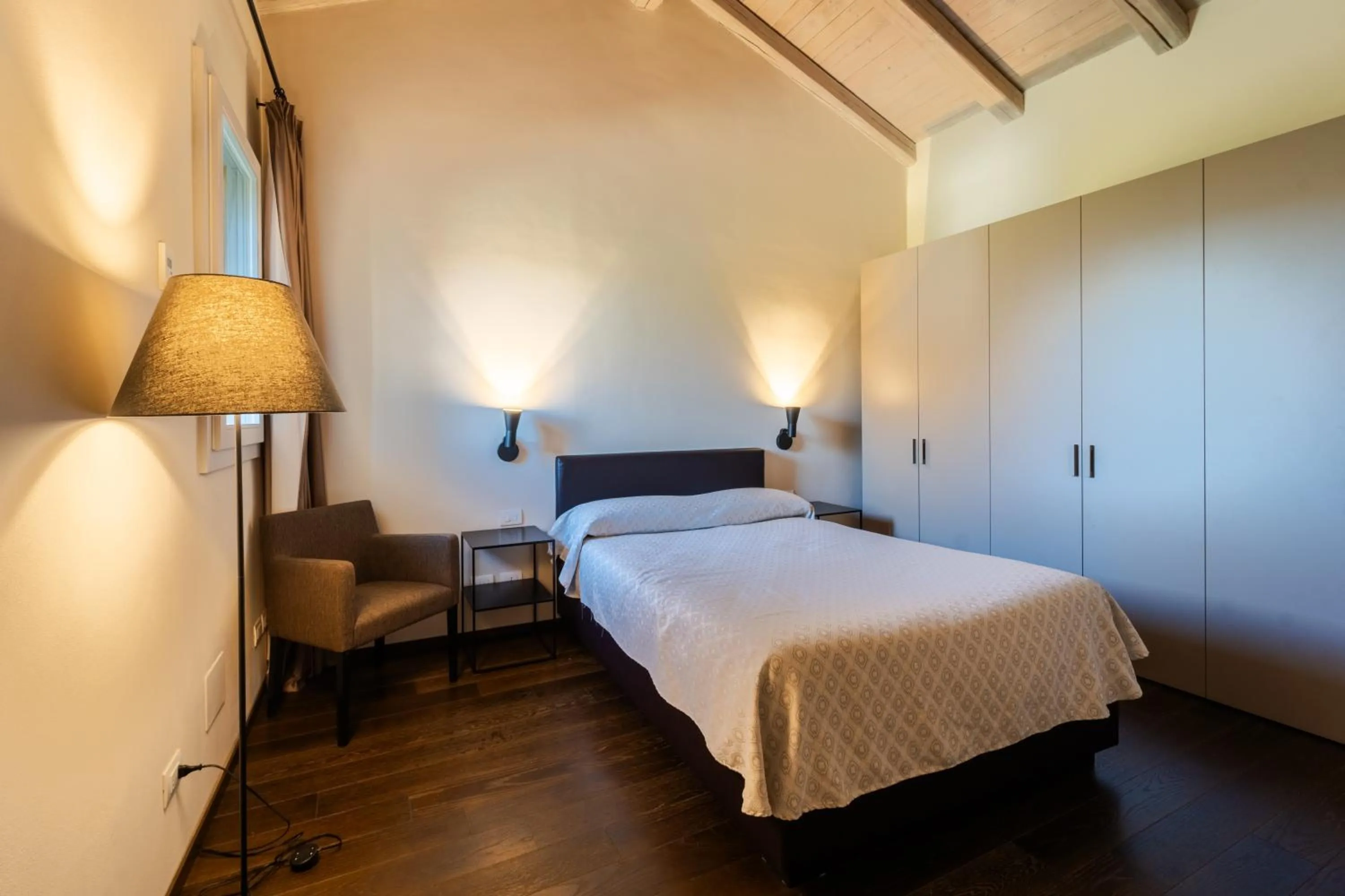 Bed in PALAZZO DE' ROSSI HOTEL