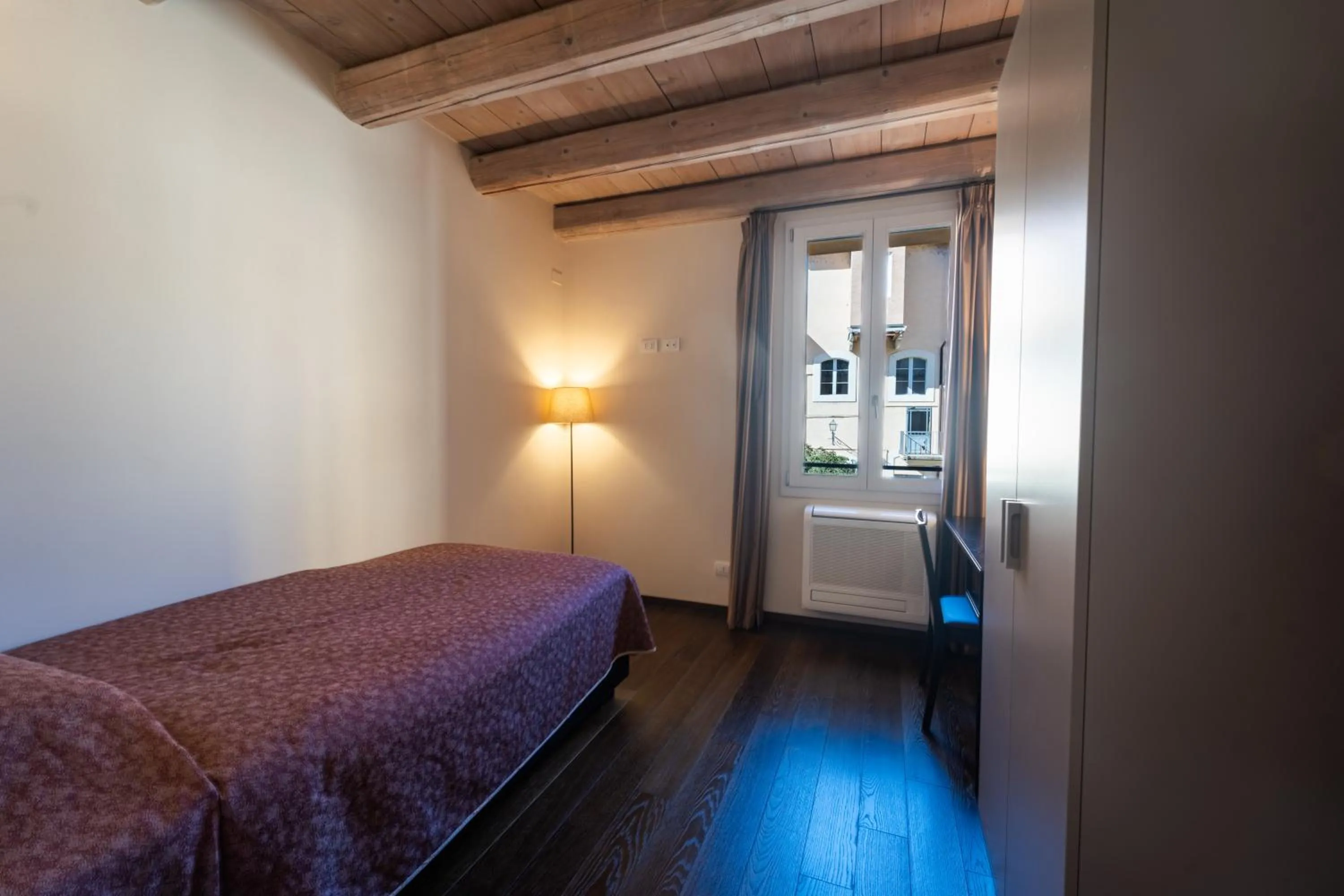 Bed in PALAZZO DE' ROSSI HOTEL