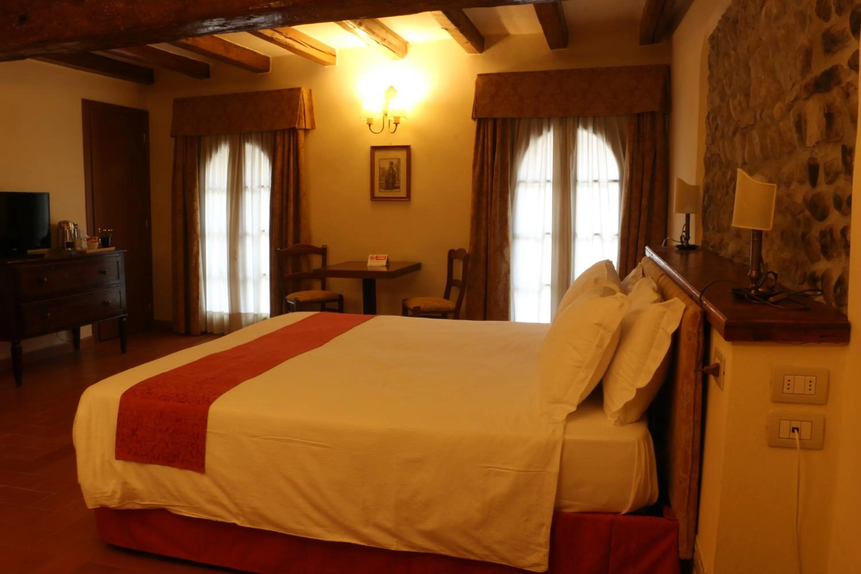 Bed in PALAZZO DE' ROSSI HOTEL