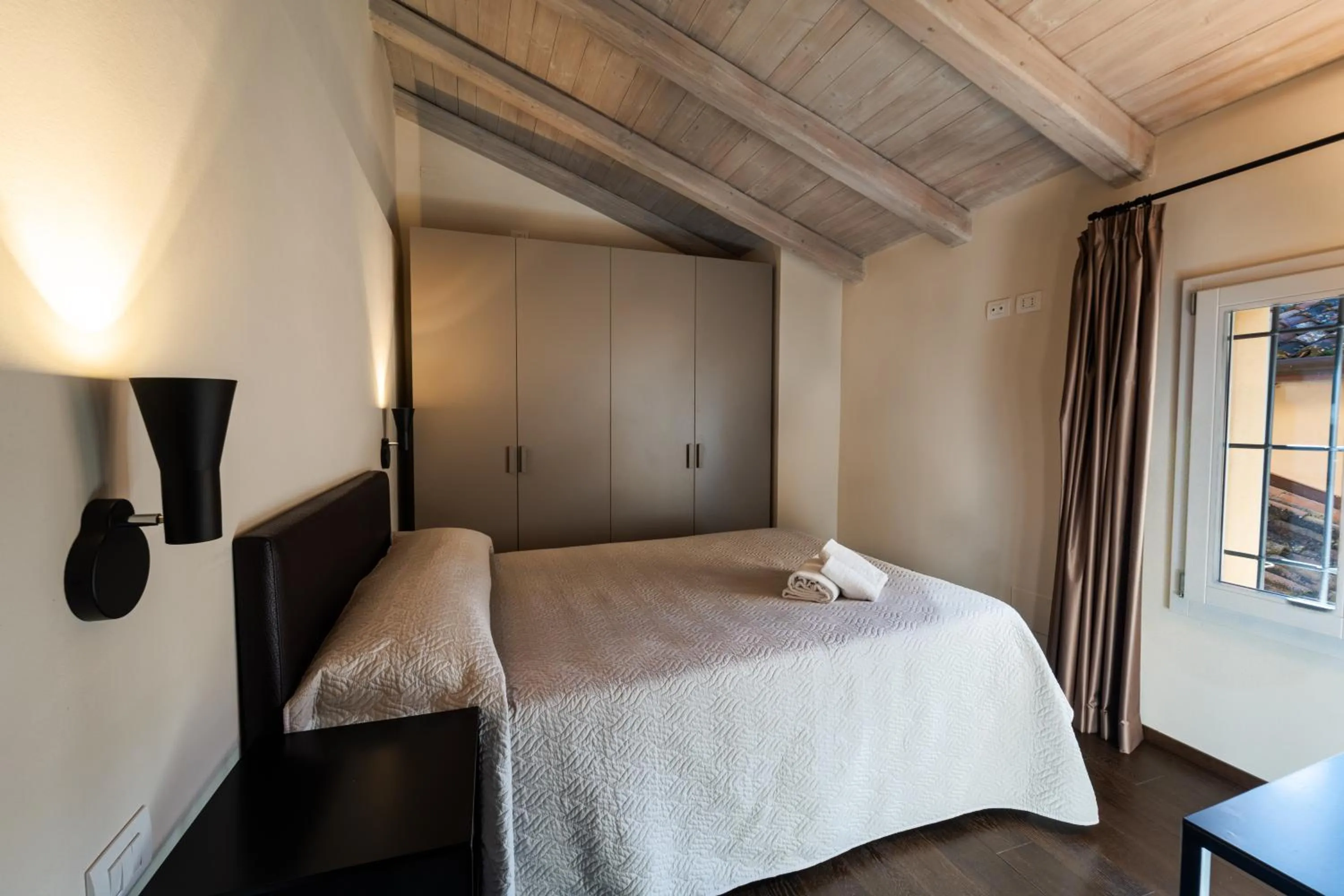 Bed in PALAZZO DE' ROSSI HOTEL