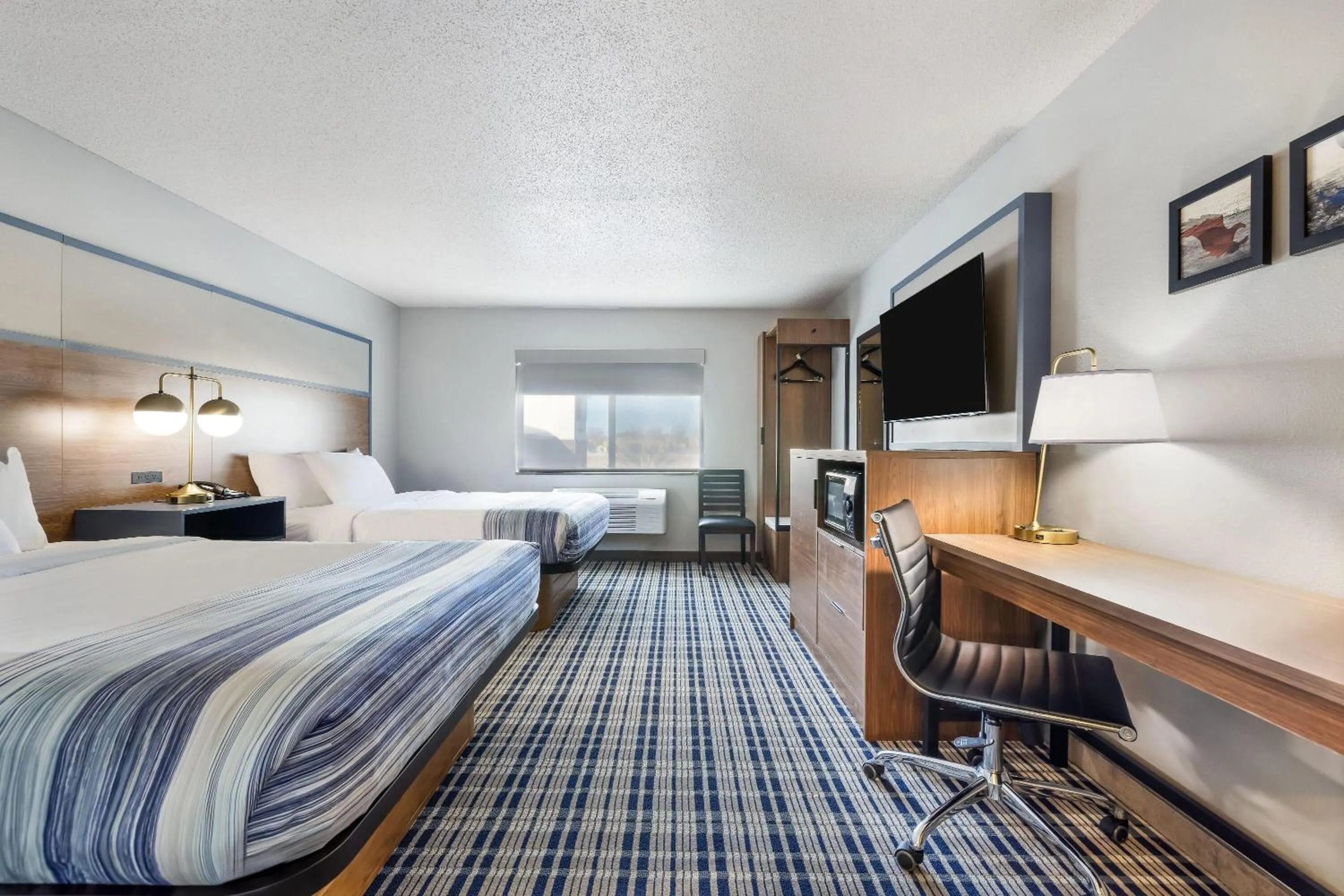 Bed in AmericInn by Wyndham Aberdeen Event Center