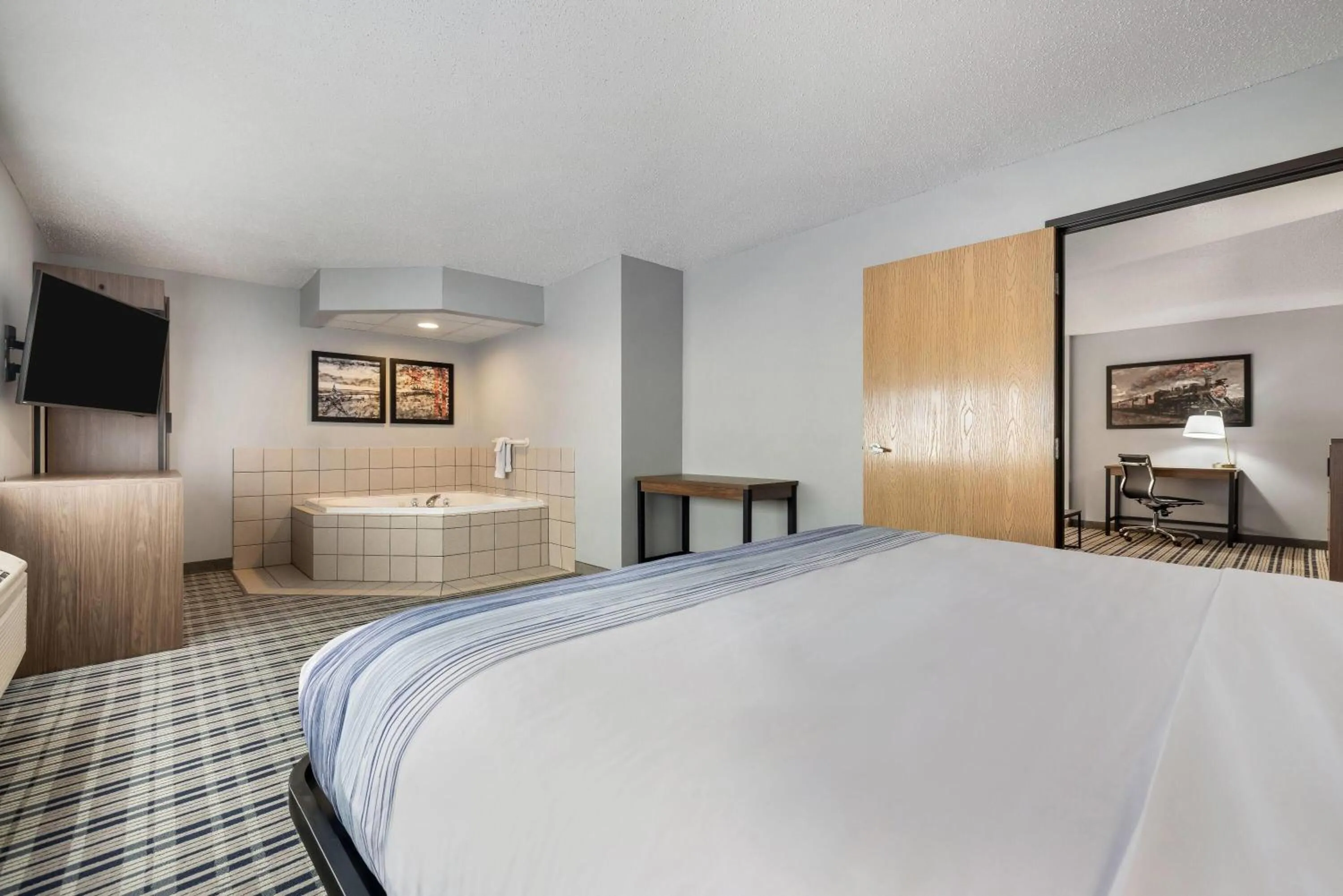 Photo of the whole room, Bed in AmericInn by Wyndham Aberdeen Event Center