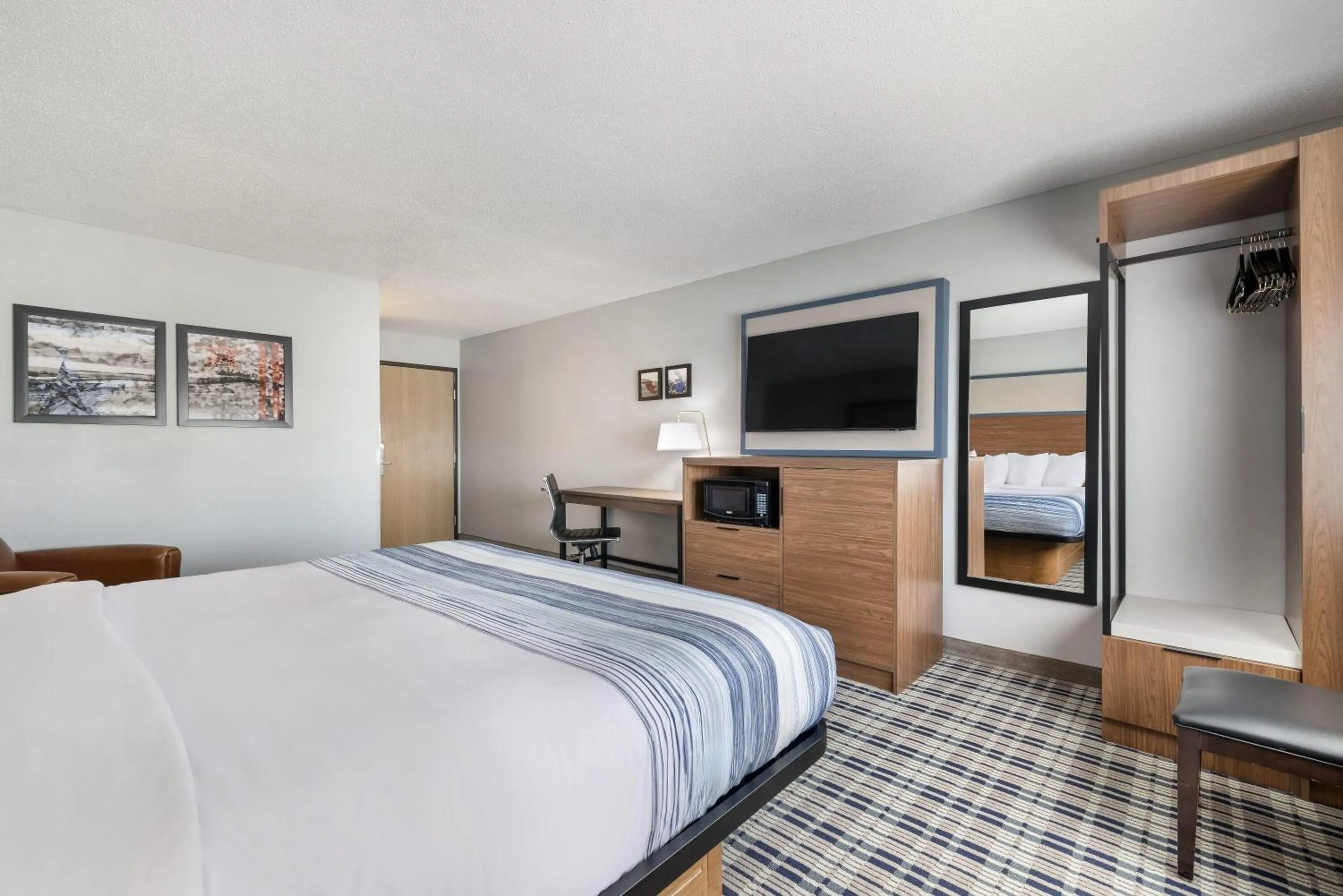 Bed in AmericInn by Wyndham Aberdeen Event Center