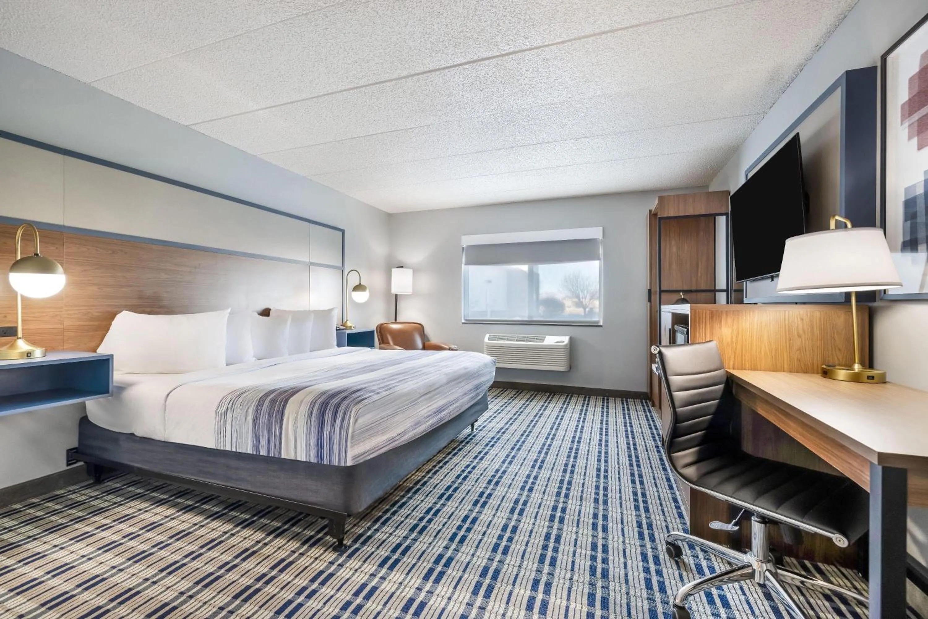 Bed in AmericInn by Wyndham Aberdeen Event Center