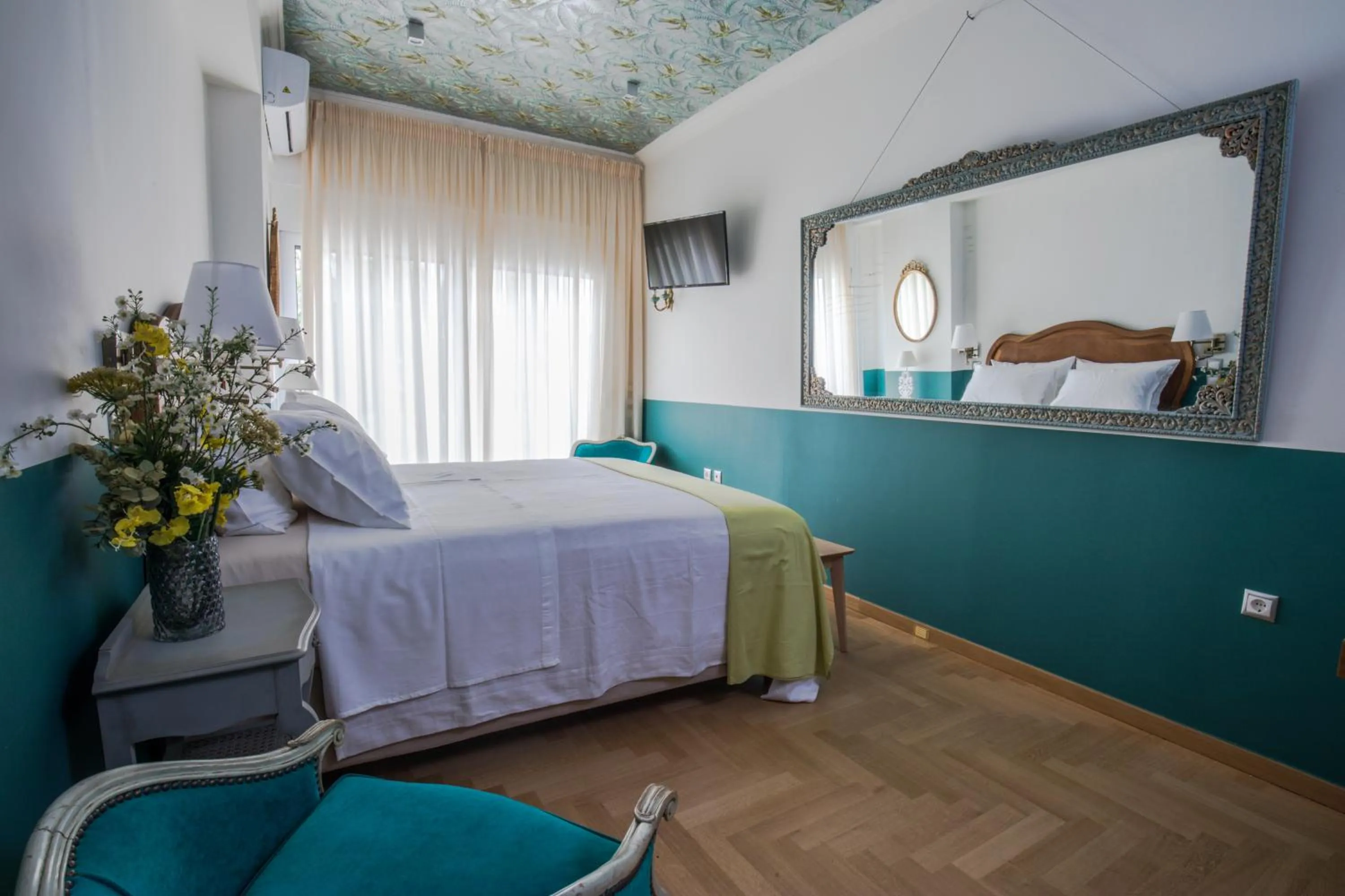 Bed in Rastoni Athens Suites near Acropolis at Tsatsou street