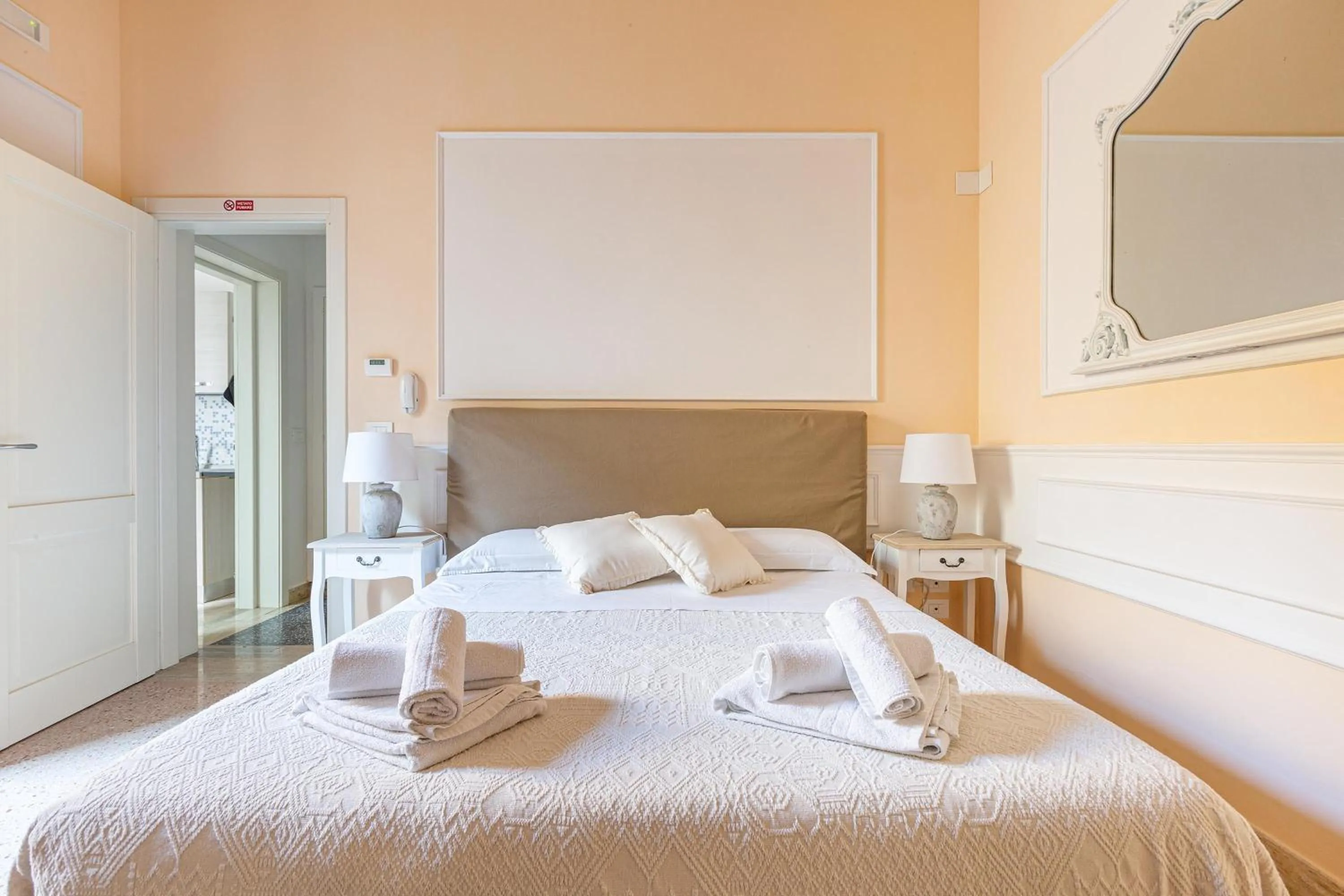 Bed in DimoraLeTreMuse Guesthouse