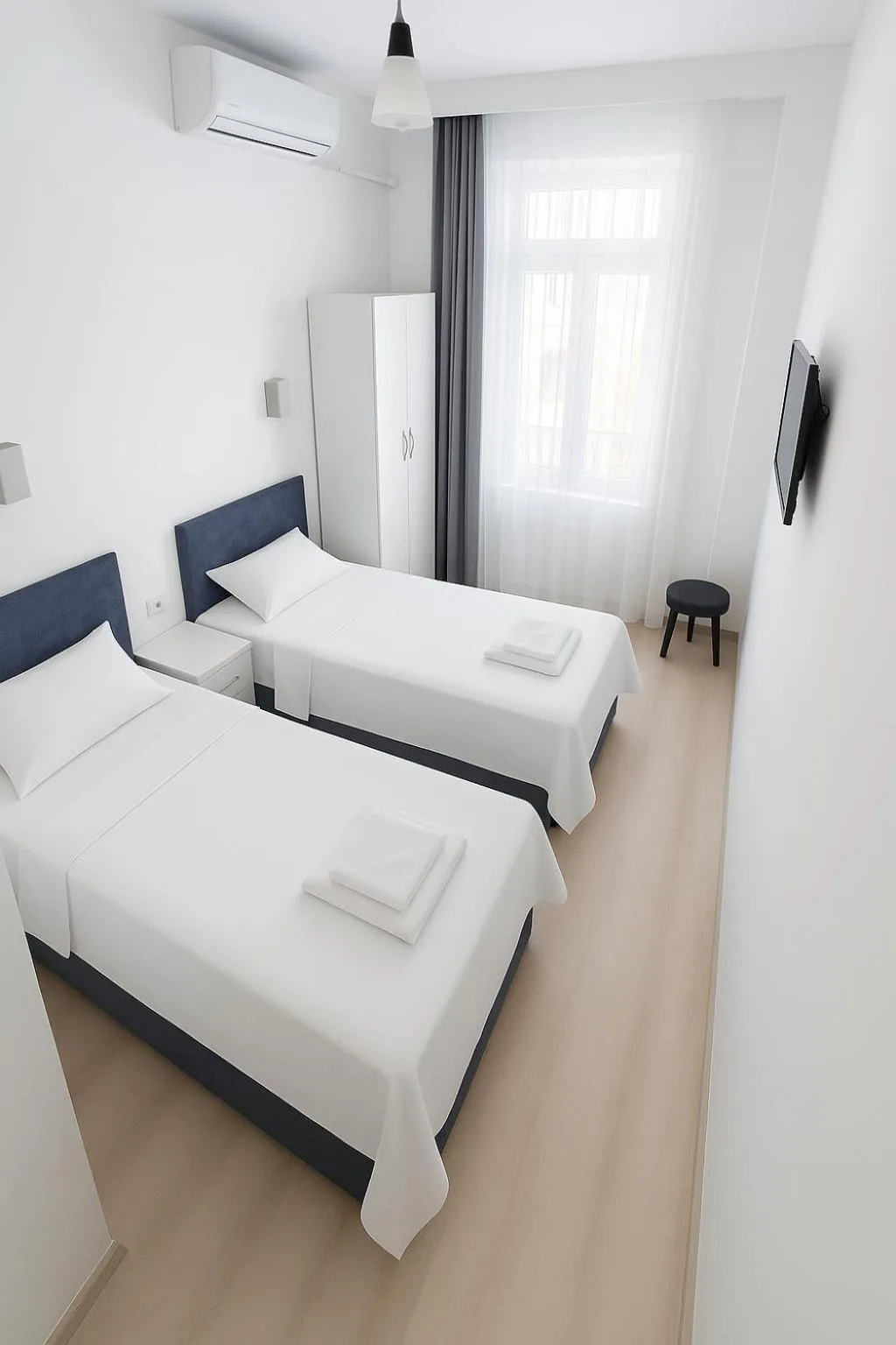 Bed in R HOUSE HOTEL