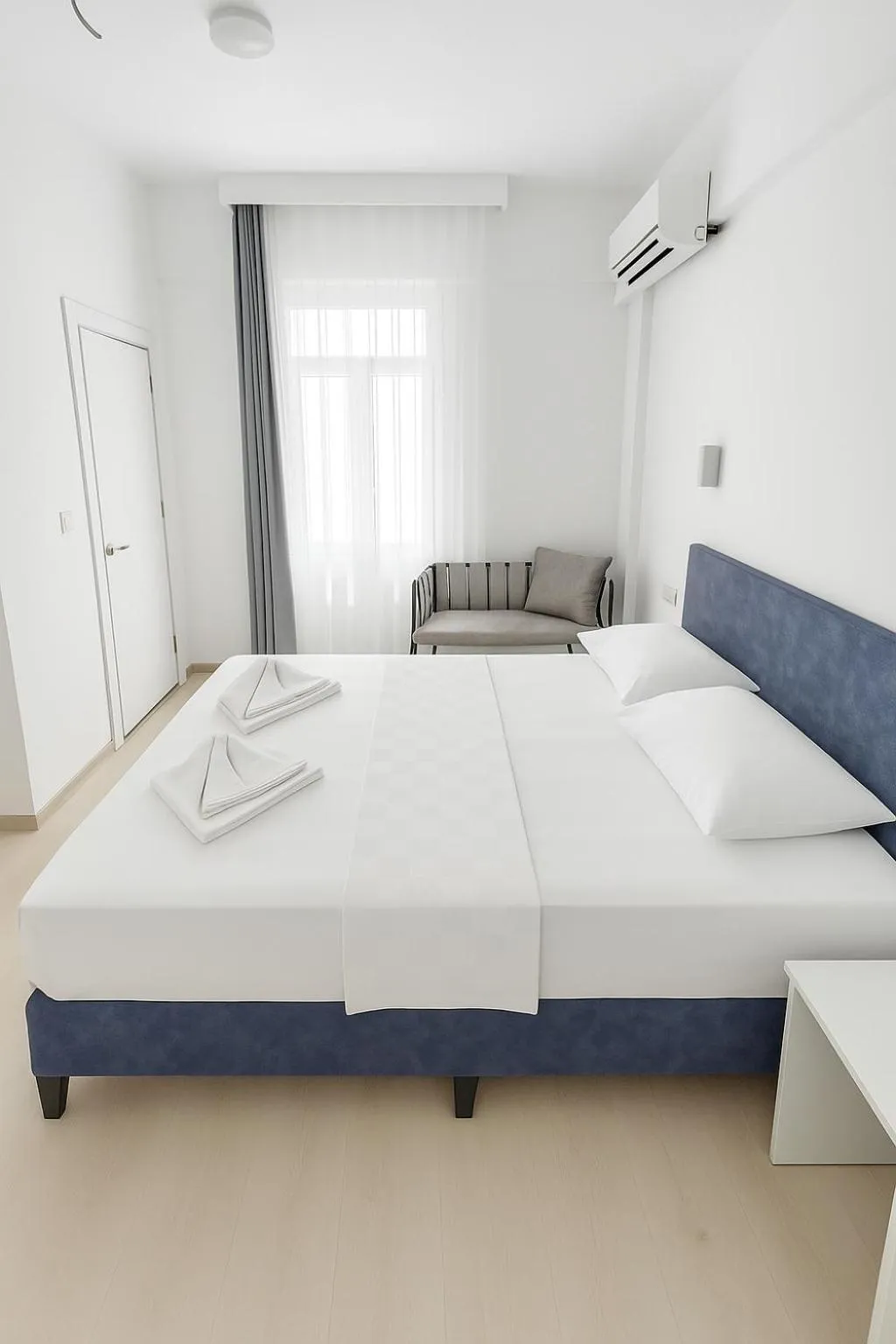 Bed in R HOUSE HOTEL